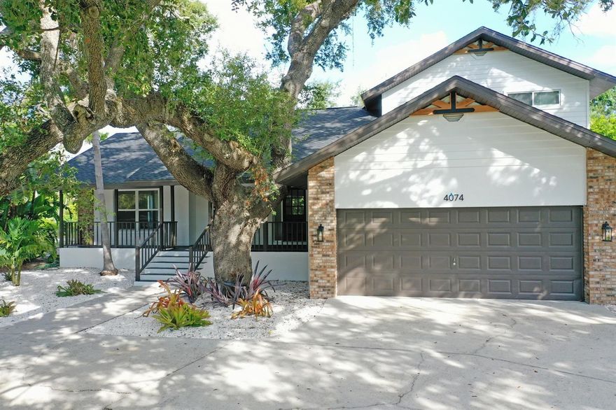 One or more photo(s) has been virtually staged. Featured on TVs Fox 4! Welcome to 4074 Redbird Cir—a home that has a LOT of personality and curb appeal. This stunning 4-bedroom, 2.5-bath has been completely renovated. This beautiful move in ready home combines classic farmhouse charm with the ease and sophistication of modern living. Nestled on an expansive third of an acre corner lot in one of Sarasota’s most desirable neighborhoods, this stunning home is a masterclass in light, space, and timeless style. This home is surrounded by many other beautiful homes, some just off the Shady Creek with boating access. The property is impressive with a large front yard and u-shaped driveway perfect for any guest parking. 

First, you are welcomed by a quaint front porch where you can enjoy a morning coffee or peaceful evenings with loved ones. Step inside to find an airy, sun-kissed interior thoughtfully designed with open-concept living and seamless indoor-outdoor flow. Vaulted ceilings and oversized windows bathe every room in natural light, highlighting the beautifully updated finishes throughout—from wide-plank floors to designer fixtures and a sleek, contemporary kitchen. The home is extremely light, bright and airy.  The main living room space is sizeable and versatile with many options for configuration. 

The kitchen is expansive, with plenty of storage and counter space, along with space for at least 8 guests with barstool seating. The sleek modern kitchen's centerpiece is a quartz waterfall island. All appliances are brand new stainless steele. Gas is available. The fireplace and hearth create an elegant and warm dynamic. The dining nook area also features a bay window. There is an adorable half bath under the stairs. The laundry room is located on the 1st floor and has a wash sink and 2 cabinets. 

The master ensuite is located on the primary level but tucked away from the main entertaining space for added privacy. The suite features high ceilings, a large walk-in closet with built ins, master bath with a spacious and open modern walk-in shower, and double vanity. The additional bedrooms are all located upstairs with a full bathroom with tub/shower combo and a double vanity.  All of the bedrooms have new ceiling fans with light. 

The spacious layout offers both comfort and flexibility, perfect for entertaining guests or simply enjoying everyday moments. Every inch has been meticulously upgraded, blending rustic warmth with contemporary finish. Outside, the generous corner lot provides room to roam, play, garden, or even add a small pool—your personal Florida retreat awaits. The majority of the property has simplified shell landscaping. There is a large screened-in lanai with fans to enjoy evenings in the backyard and space for a jacuzzi. Plenty of space on the back patio to grill.  Fantastic yard with mature landscaping and a 2-car garage. The garage has many built in cabinets and shelving perfect for a workshop or man cave. Side yard fenced perfect for pets. 

Brand new roof, complete repaint inside and out, newer AC, and much of the plumbing was updated to PVC.

Stellar location just minutes to Siesta Key Beach—frequently rated the BEST beach in America, Siesta Key. Close to A+ schools, downtown Sarasota, major shopping, Cinebistro, Trader Joe's and many high-end restaurants and steakhouses.

Seller open to a rate buy down scenario or a crypto purchase please consult for more details!