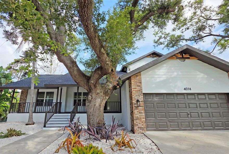 One or more photo(s) has been virtually staged. As featured on Fox 4. Major Price Adjustment, Motivated Seller! 

Welcome to 4074 Redbird Cir—a home that has a LOT of personality and curb appeal. This stunning 4-bedroom, 2.5-bath has been completely renovated. This beautiful move-in-ready home combines classic farmhouse charm with the ease and sophistication of modern living. Nestled on an expansive third of an acre corner lot in one of Sarasota’s most desirable neighborhoods, this stunning home is a masterclass in light, space, and timeless style. This home is surrounded by many other beautiful homes, some just off the Shady Creek with boating access. The property is impressive with a large front yard and u-shaped driveway perfect for any guest parking. 

First, you are welcomed by a quaint front porch where you can enjoy a morning coffee or peaceful evenings with loved ones. Step inside to find an airy, sun-kissed interior thoughtfully designed with open-concept living and seamless indoor-outdoor flow. Vaulted ceilings and oversized windows bathe every room in natural light, highlighting the beautifully updated finishes throughout—from wide-plank floors to designer fixtures and a sleek, contemporary kitchen. The home is extremely light, bright and airy.  The main living room space is sizeable and versatile with many options for configuration. 

The kitchen is expansive, with plenty of storage and counter space, along with space for at least 8 guests with barstool seating. The sleek modern kitchen's centerpiece is a quartz waterfall island. All appliances are brand new stainless steel. Gas is available. The fireplace and hearth create an elegant and warm dynamic. The dining nook area also features a bay window. There is an adorable half bath under the stairs. The laundry room is located on the 1st floor and has a wash sink and 2 cabinets. 

The master ensuite is located on the primary level but tucked away from the main entertaining space for added privacy. The suite features high ceilings, a large walk-in closet with built-ins, master bath with a spacious and open modern walk-in shower, and double vanity. The additional bedrooms are all located upstairs with a full bathroom with tub/shower combo and a double vanity.  All of the bedrooms have new ceiling fans with light. 

The spacious layout offers both comfort and flexibility, perfect for entertaining guests or simply enjoying everyday moments. Every inch has been meticulously upgraded, blending rustic warmth with contemporary finish. Outside, the generous corner lot provides room to roam, play, garden, or even add a small pool—your personal Florida retreat awaits. The majority of the property has simplified shell landscaping. There is a large screened-in lanai with fans to enjoy evenings in the backyard and space for a jacuzzi. Plenty of space on the back patio to grill.  Fantastic yard with mature landscaping and a 2-car garage. The garage has many built-in cabinets and shelving perfect for a workshop or man cave. Side yard fenced, perfect for pets. 

Brand new roof, complete repaint inside and out, newer AC, and much of the plumbing was updated to PVC.

Stellar location just minutes to Siesta Key Beach—frequently rated the BEST beach in America, Siesta Key. Close to A+ schools, downtown Sarasota, major shopping, Cinebistro, Trader Joe's and many high-end restaurants and steakhouses.

Seller open to a rate buy-down scenario or a crypto purchase please consult for more details! Bring a contract today!