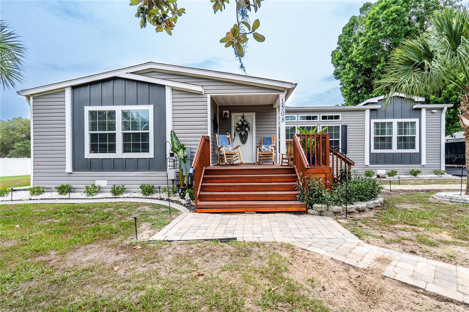 Stunning 2,352 square foot 3-Bedroom, 2-Bathroom Manufactured Home on 0.62 Acres with NO HOA – Your Dream Oasis Awaits! PLUS...There is AN ADDITIONAL 1.25 acres is available adjacent to this property for a potential total of 1.87 Acres!! Not too big, but not too small either!
Welcome to your perfect retreat located 1/2 mile from the entrance to the Withlacoochee State Trails! This exquisite 3-bedroom, 2-bathroom manufactured home boasts all the modern conveniences and luxurious features you could desire. Nestled on a spacious 0.62-acre lot, this home offers an inviting foyer that leads you into a bright, open floor plan with an impressive spacious layout!
Key Features:
- Light-Filled Living Spaces: Enjoy the large living room featuring an inset for a big-screen TV, canned lighting, a wood burning fire place with stunning masonry accents and side shelving for your decor.
- Gourmet Kitchen: Cook and entertain in style with a spacious island and stools, abundant wood cabinetry, a modern chic range with a separate oven, and a butler's service area.
- Formal Living Room is the perfect additional space for entertainment, your own hideaway, playroom, or just an additional area to spend time with friends and family!
- Elegant Dining Room: Featuring a trayed ceiling, perfect for hosting gatherings.
- Master Suite Retreat: Relax in the master bedroom with plush carpet, leading to a luxurious and upgraded en-suite bathroom that will make anyone jealous! Equipped with his and hers bathroom sinks, plenty of counter and cabinetry space, a garden tub, separate large shower with plenty of space for two, a double seat, and ample space for comfort!
- Spacious Secondary Bedrooms: Two generously sized bedrooms with large walk-in closets and a well-appointed secondary bathroom featuring an oversized bathtub. One of the secondary bedrooms has a custom organized closet system, perfect for keeping your things organized!
Outdoor Paradise:
Step outside to discover your private outdoor oasis! The backyard is beautifully landscaped and features:
- Oversized Pavered Patio: Perfect for entertaining, with two stunning brick pavered waterfalls and accent landscape walls.
- Gazebo Retreats: Two gazebos, one with a high-end hot tub and another with a spacious seating area ideal for starry nights.
- Fire Pit
- Refreshing Above-Ground elongated Swimming Pool: Dive into summer fun!
- Covered Grilling Area: Perfect for BBQs with friends and family.
- Multiple Storage Options: Includes a storage shed with electricity and a barn for all your projects.
- Large raised composite wood deck off of the pavered deck...perfect for additional lounging, entertainment, relaxing, and/or eating!
Extra Features:
- 6 Inch Exterior Wall Upgrade, makes this home extra solid and insulted.
- Interior Drywall throughout interior of home.
- Beautiful Clear Glass Door at Front
- Arched walkways throughout the home add character.
- Vinyl plank flooring and carpet create a cozy yet stylish interior throughout.
- Laundry room with cabinets and sink for convenience.
- Hurricane-grade windows for sound insulation and safety.
- Fenced and gated property with an asphalt driveway leading to brick paver walkways.
-Gutters and Downspouts on entire home.
This home combines modern elegance with comfort, making it an ideal family retreat or entertaining space. Don’t miss out on this incredible opportunity to own your dream home with all the bells and whistles!
