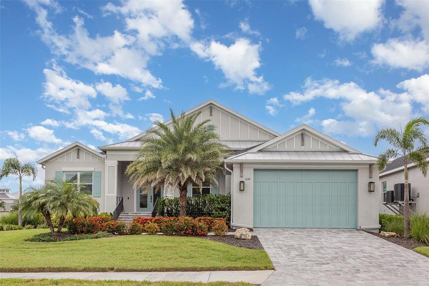 One or more photo(s) has been virtually staged. 3926 SQF home! COMMUNITY BOAT SLIPS COMING SOON. Elevated home that received NO DAMAGE DURING HURRICANES - BUILT TO HIGHEST BUILDING STANDARDS-ELEVATED RANCH HOME!  Step into luxury coastal living in this nearly new 4-bedroom plus a den/possible 5th bedroom home located just minutes from the pristine beaches of Anna Maria Island. Built in 2022 and meticulously upgraded throughout, this residence in Palma Vista offers refined style, smart-home features, and effortless indoor-outdoor entertaining on a beautifully landscaped corner lot. Bike to Anna Maria Island beaches. Close to IMG and other shops, entertainment and restaurants, and parks.

Interior Highlights
3,926 Toal area sq ft of open-concept living, filled with natural light and designer finishes

Imagine your very own Chef’s kitchen cooking holiday dinners and entertaining with white quartz countertops, an oversized island ready for entertaining a large crowd of friends, custom 42" cabinetry with crown, high-end stainless appliances, and built-in state of the art Dacor convection oven that advises you on how to cook for your guests. 

Spacious great room with custom media wall, electric fireplace, and 75" TV niche watch all your favorite games in style both inside and out side  with High Def TV's 

Porcelain wood-look tile flooring throughout main living areas. makes clean up a breeze. 

Primary suite retreat with two walk-in closets, No more space issues for you here.  The spa-style bath with dual sinks, quartz vanity, and luxury large frameless glass walk-in shower will have you relaxing in no time. 

Private DEN/ 5th bedroom has double doors opens to lanai—perfect as a home office, guest suite, or media room- No closet. 

This home will leave you not wondering if you turned something off or if the home is ready for your arrival once you program all of your Smart features of the home including the upgrades include zoned HVAC. No storm worries here with the highest rated impact-rated doors and windows, Smart car or golf cart lovers can be worry free with the garage EV charging outlet, and epoxy-coated garage flooring
 Outdoor Living & Entertaining at its best with your private lap pool which is a
Heated saltwater gunite pool with custom 14' x 24' waterfall feature, Colored light for the atmosphere you desire and self-fill feature which means worry free care. 

Screened lanai with extended paver patio, ideal for relaxing and hosting that opens to the living area of the interior of the home kitchen, and great room areas

Professionally landscaped 0.29-acre corner lot with irrigation and paver driveway

Palma Vista is a community where coastal charm meets convenience:
Planned private boat slips (available at additional cost) for eligible residents—including this seller
Community has Planned Sunset pier, kayak launch, and secure kayak storage coming soon and in the works. 

 Quality Construction & Peace of Mind
Built to modern flood elevation standards

Impact-rated windows & doors, enclosed soffits, and gutters

At a Glance
Bedrooms / Bathrooms 4 BEDROOMS PLUS A DEN/5TH BEDROOM 
Living Space 3,926 total Sq Ft
Boat Access Eligible for Boat Slip (Coming Future plans)- (Optional Cost)
Outdoor Amenities: Private community path to Park with Ball fields, parks and picnic areas, Dog friendly area, pond.
Centrally located with easy access to downtown Bradenton, IMG Academy, and Sarasota, and Anna Maria Beaches- Buyer to verify all info for accuracy.