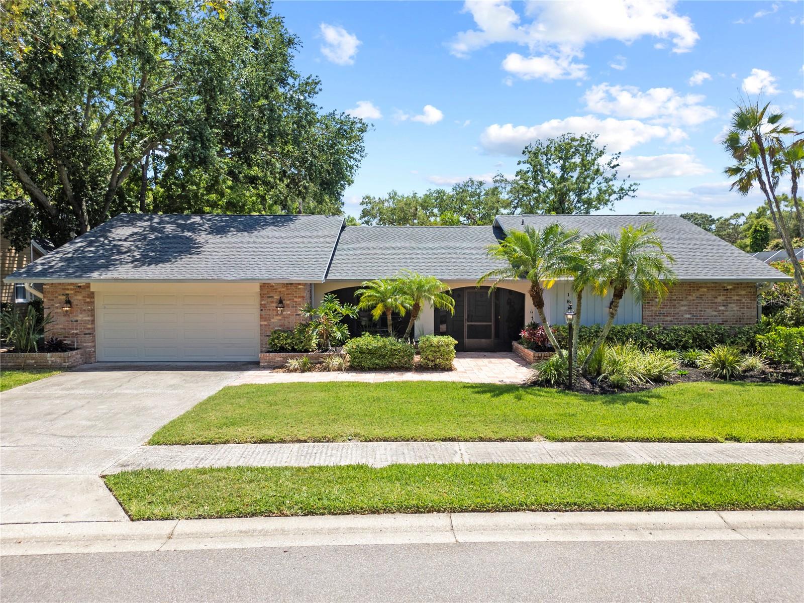 A Rare Find in Rainbow Farms, a custom-built 4-bedroom, 3-bath home by Mark Maconi, perfectly situated in the sought-after Rainbow Farms neighborhood of Safety Harbor. This home isn't just beautiful—it's built to last, with top-quality construction, modern updates, and high-end finishes that make it a true standout.No Flood Insurance Required.
The home has been consistently upgraded, with the crown jewel being the 2021 GAF roof, You'll also enjoy peace of mind with double-paned windows, a hurricane-rated garage door, and a 2-car garage with new epoxy flooring.
Inside, you’re welcomed by new Italienne ceramic tiles in the formal living spaces and luxury vinyl with isolation backing in the master suite. The floor plan features five sliding glass doors, bringing in natural light and offering access to the central courtyard pool area from multiple rooms, including the great room, master bedroom, formal dining, and breakfast room.
The rear suite is a flexible space with a private updated full bath, ample closet storage, and direct pool access—perfect for a guest room, home office, or fitness space. The great room boasts vaulted ceilings, an updated wet bar, and a seamless pass-through to the upgraded kitchen, which features wood cabinets, solid surface counters, ceramic backsplash, stainless steel appliances, and a walk-in pantry.
In the master suite, enjoy an expansive space with a dressing area, his and hers walk-in closets, and tranquil access to the backyard. The indoor laundry room with built-in cabinets sits conveniently off the garage.
Outside, indulge in your private oasis with a screened lanai, a newly resurfaced pool, 2023 coping, and brand-new pool equipment—surrounded by manicured landscaping and a mature 8-foot viburnum hedge that provides total privacy along the western lot line.
Energy-efficient upgrades abound, from the double-paned windows to the high-SEER HVAC system, and a separate HVAC unit just for the master bedroom.
Positioned near elite public and private schools, four shopping centers, two business parks, and just minutes from SR 580, McMullen Booth Rd, downtown Safety Harbor, Clearwater, St. Pete, and both international airports—this home offers unbeatable location, luxury, and value.