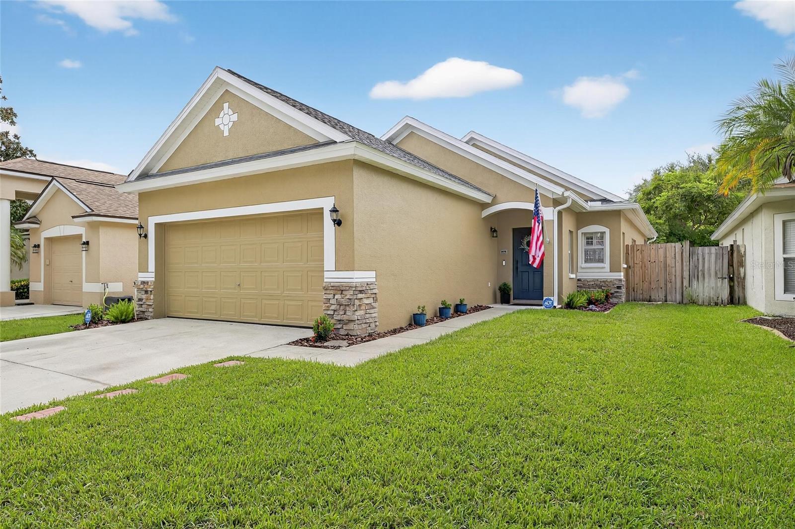 Charming light and bright home in Covington Park in Apollo Beach. This beautiful home has porcelain tile throughout the main living areas, open floor plan, large primary bedroom with bath ensuite, 2 additional bedrooms and bathroom. Spacious lanai extends the full length of the home looking out onto the private fenced in grassy yard. New landscaping, newer roof (2020), new AC (2025), upgraded insulation for energy efficiency, newer fencing (2023), new exterior painting (2025), plantation shutters, security system (2025). Covington Park offers a community pool, playground and tennis courts.