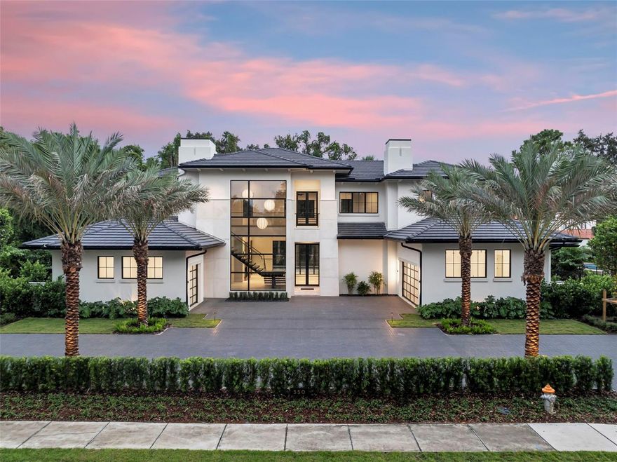 Exquisite new construction in the Heart of Winter Park perfectly positioned on an oversized lot just steps from Park Avenue’s renowned shops, fine dining, and the iconic Winter Park 9-hole golf course, this extraordinary custom residence is a showcase of timeless design and modern luxury. Conceived by acclaimed architect Dan Delong of Origins Residential Design and brought to life by Sean Wulff of Native Homes, every detail has been thoughtfully curated to impress even the most discerning buyer. The expansive floor plan encompasses 5 bedrooms, 6 full baths, and 1 half bath, blending sophistication and comfort across multiple living spaces. Highlights include a dramatic great room, inviting family room, private study, downstairs guest suite, a full bar featuring a 56-bottle wine refrigerator, and an upstairs game room ideal for both everyday living and elegant entertaining. A grand entry reveals the great room with soaring floor-to-ceiling windows and elegant Italian porcelain tile, all overlooking the serene pool and patio. The chef’s kitchen seamlessly connects to the family room and features Canadian-crafted European-style cabinetry, Wolf, Sub-Zero & Fisher & Paykel appliances (dual ovens, dual dishwashers, built-in coffee maker, wine cooler, and beverage center), quartzite countertops, a large island with bar seating, hidden walk-in pantry, plus whole house water softener and filtration systems for premium convenience. The first-floor primary suite is a true retreat with spa-inspired amenities and a custom-built walk-in closet complete with cabinetry and a spacious island. Also on the main level: a private guest suite and dedicated home office/study. Upstairs, a generous game room and three additional en suite bedrooms provide comfort and privacy for family and guests alike. Designed for seamless indoor-outdoor living, the residence boasts two covered lanais finished in Turkish Marble, disappearing screens, a summer kitchen with Urban Bonfire Cabinetry, refrigerator, and ice maker, along with a freestanding fire pit and lush tropical landscaping. The saltwater pool with sun shelf and heated gas spa ensures year-round enjoyment. Built to the highest standards, the home features R-14 block walls with core 500 insulation, open cell foam insulation in attic, Andersen windows, a flat concrete tile roof, and tongue-and-groove ceilings on all lanais. Additional luxuries include:
Select European white oak wood floors and Italian porcelain flooring throughout
12’ ceilings on the main level, 10’ ceilings upstairs
Cutting-edge construction for efficiency and durability