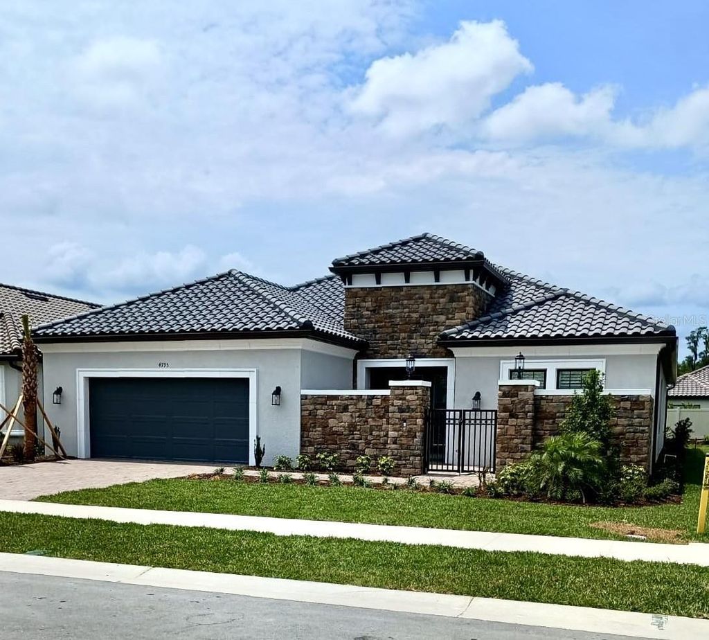 Photo of 4795 Freccia Loop, Wesley Chapel, FL 33543 (MLS # J975685)