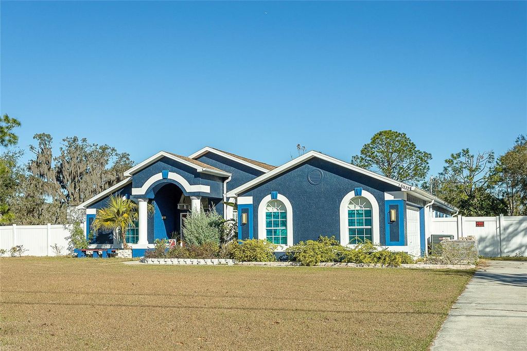 Photo of 31439 Stirrup Lane, Wesley Chapel, FL 33543 (MLS # TB8468095)