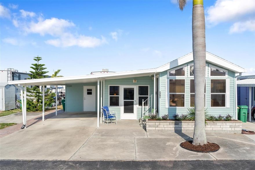 $15,000 PRICE ADJUSTMENT ON THIS CUTE VACATION HOME (turnkey furnished) on this rarely available DOUBLE LOT, situated in the heart of this vivacious 55+ mobile home community of Holiday Travel Park, located in beautiful Englewood, FL! This lifestyle isn't just retirement...it's more like recess! For $100,000 you'll get double the space!!
Located just 5 minutes away from Englewood Beach, this charming retreat will captivate you by the abundance of natural light that floods the open living spaces. The expansive windows and vaulted ceilings throughout showcase panoramic views of the exterior, creating a serene atmosphere that invites you to unwind & recharge.
The interior boasts a tastefully decorated living room, where you can gather with family and friends to share laughter and create cherished memories. The kitchen features a microwave, range/oven, refrigerator, and ample countertop/cabinet space, making meal preparation a breeze. The dining area is located just off the kitchen, making for a truly functioning open floor plan!
The bathroom features some cute updated & modern LVP flooring. Step back into the bedroom where you’ll find a comfortable of bed, a built-in desk, & spacious closet. This room also has access to the first floor Florida room, fully enclosed and part of the HLA. The beautiful windows & relaxing setup create a tranquil retreat with plenty of space to host your guests! The indoor laundry room (accessible through the Florida room) features storage space, washer and dryer, as well as deep freezer chest that all convey with the sale of the home.
As you step outside, you'll be greeted by the beauty of the double lot, allowing for endless outdoor possibilities. 
Check out that carport - plenty large enough to park two cars (tandem), or your car and a golf cart! The storage closet sits at the back of the carport. Also unique to this property is the attached and deeded vacant lot just to the south end of this property…perfect for hosting your guests in their RV or Travel Trailer. The shed on this property is additional storage, and everything conveys with sale of this property!
Whether you desire a peaceful morning coffee on the patio, a vibrant outdoor oasis, or an entertaining space for barbecues and social gatherings, this property provides the perfect canvas for your personal vision. HVAC: 2023; ROOF: 2023; ELECTRIC WATER HEATER: 2008. 
Holiday Travel Park itself offers a wealth of amenities for residents to enjoy. Take a refreshing dip in the sparkling swimming pool, challenge friends to a game of shuffleboard or indoor pickleball, or simply take a leisurely stroll through the meticulously maintained grounds. The park also offers organized activities and events, fostering a vibrant sense of community, especially during their peak season!
Located in Englewood, FL, this mobile home is perfectly situated to take advantage of the area's natural beauty and recreational opportunities. Explore the pristine sandy beaches just minutes away, where you can soak up the sun, collect seashells, or engage in water sports to your heart's content. Englewood is also renowned for its charming downtown area, lined with unique shops, art galleries, and delightful restaurants. Indulge in fresh seafood cuisine or savor the flavors of local eateries, all within easy reach. Embrace the coastal lifestyle, create everlasting memories, and experience the true essence of Englewood.