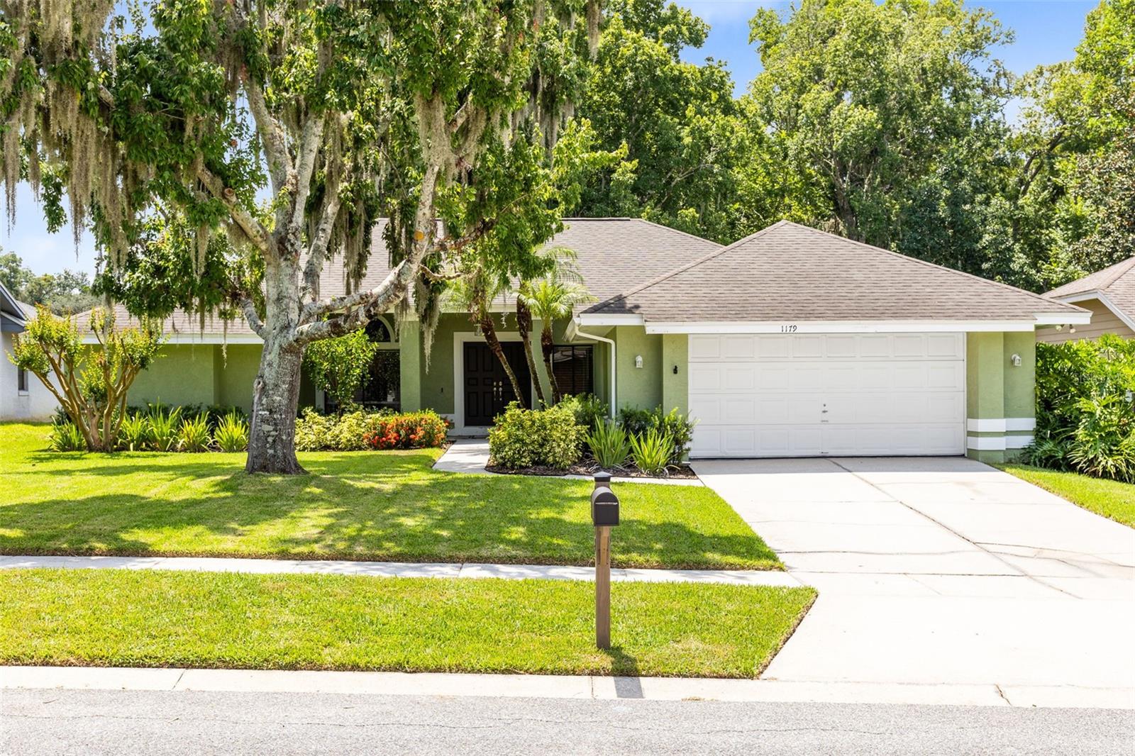 Welcome to 1179 Freedom Lane in the highly desirable Oak Forest community! This beautifully updated 3-bedroom, 2.5-bathroom home offers just under 2,000 sq. ft. of thoughtfully designed living space on a spacious 1/4 acre lot with no rear neighbors. From the moment you arrive, the stunning curb appeal sets the tone for the charm and comfort found throughout. Step inside and be greeted by a massive, open living room complete with a cozy reading nook, perfect for quiet moments. The split floor plan provides privacy, while the freshly painted interior and vinyl flooring throughout give the home a modern, low-maintenance feel. The updated bathrooms are absolutely gorgeous and on-trend, including a luxurious master suite featuring an oversized step-in shower. The bright breakfast nook with a bay window overlooks the large, newly fenced backyard—a private retreat perfect for every type of gathering. The modern kitchen boasts stainless steel appliances and plenty of storage, making it a chef’s delight. Step out onto the screened-in patio to enjoy morning coffee or evening sunsets. Located in the sought-after Oak Forest neighborhood, this home is zoned for top-rated Seminole County Schools and just minutes from all that Winter Springs has to offer. You'll love the convenience of living right off Tuskawilla Road with easy access to dining, shopping, and major roadways. Don’t miss your chance to own this move-in ready gem with space, style, and privacy!