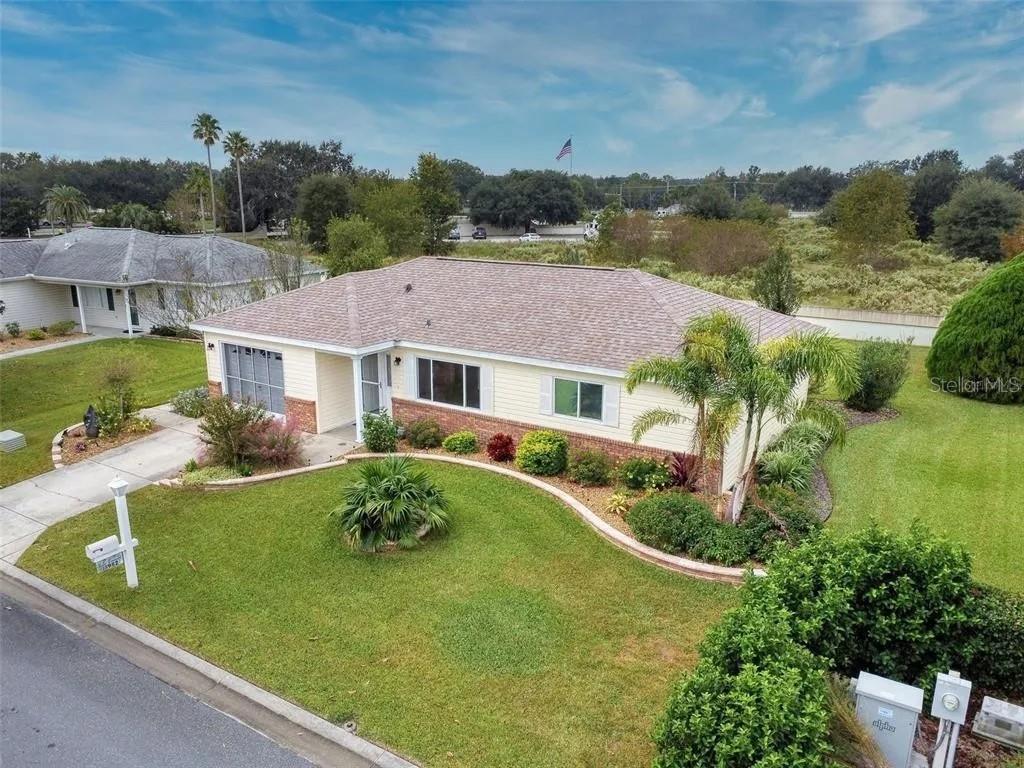 Cozy 2-Bedroom Home in Spruce Creek Golf & Country Club – 55+ Community! Discover comfort and convenience in this well-maintained 2-bedroom, 1-bathroom home nestled in the heart of the Spruce Creek Golf & Country Club—a highly desirable 55+ gated community in Summerfield, FL. Offering 943 sq ft of thoughtfully designed living space, this home is perfect for year-round living or a seasonal retreat. Step inside to an inviting open-concept layout featuring a spacious living and dining area with abundant natural light. The kitchen is equipped with ample cabinetry, a breakfast bar, and an efficient layout that makes daily living a breeze.