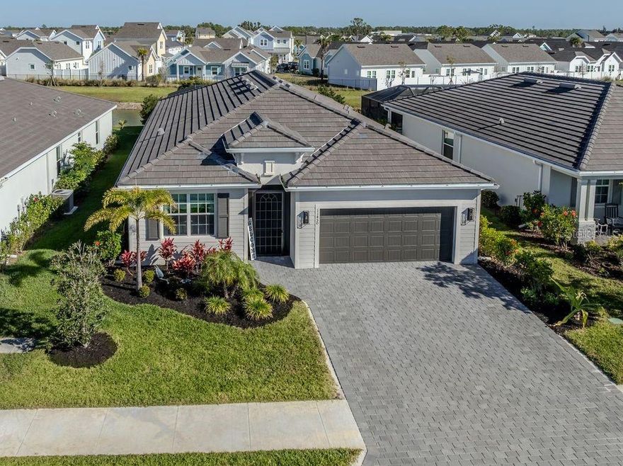 Experience the pinnacle of Florida living in this stunning new construction community located in Wellen Park, the fastest growing master-planned community in the state. This exquisite Marsala model features three bedrooms, three bathrooms, and a versatile den, providing ample space for family life and entertaining. Step outside to your own relaxing private heated pool and spa, perfect for those sunny Florida days.

The home is packed with custom features and upgrades that elevate its appeal. You’ll find upgraded appliances, including a new washer/dryer, dishwasher, stove, and microwave hood. The stylish lanai boasts a beautiful wood ceiling and ceiling fan, complemented by privacy landscaping that enhances your outdoor space. Functional whole house gutters protect your investment, while the widened driveway, expanded by six feet, offers additional parking.

Inside, you'll appreciate the new solid interior doors and closet doors, along with a stylish front door featuring a wood grain finish. Updated door hardware includes new exterior door handles and locks, including for the sliding doors. The home also offers efficient storage solutions with closet organizers and laundry cabinets, along with aesthetic enhancements such as accent walls and fresh paint throughout.

Modern bathroom features include an added glass shower door in the second ensuite and new faucets for all sinks and showers. For your convenience, a Generator switch and fuse box, as well as a water softener and a reverse osmosis system with remineralizer, have been installed, ensuring a comfortable living experience. The kitchen is a chef’s dream with a beautiful backsplash that completes the look.

This community is situated near beautiful beaches, local parks, and a vibrant dining scene. Downtown Wellen features a scenic lake, a splash pad perfect for families, a playground, and a bustling farmers market every Sunday. Don’t miss your chance to own this upgraded home in a prime location!