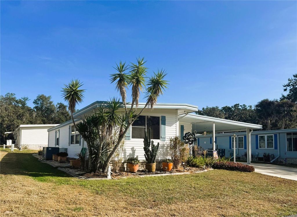 Photo of 202 Aspen Circle, Leesburg, FL 34748 (MLS # R4910484)