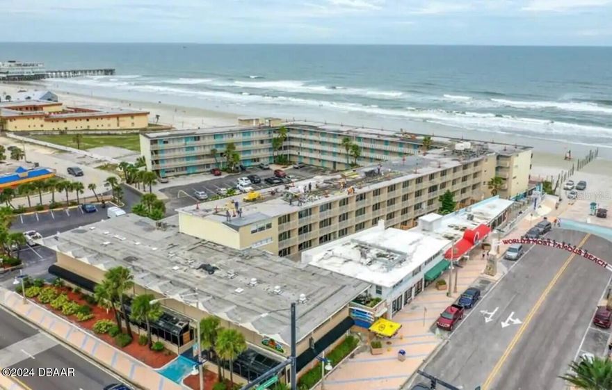 Beachfront Condotel with no rental restrictions. Animal friendly property. Rent it out or have your own beach escape. Strong six year rental history with average of 20k annually income when renting short term. New inside paint and under the sea decor. ALL assessments are paid in full! There are no further knowledge of assessments. New roof, new pool, pool showers, new seawall, new drainage system, newly paved parking lot, new building concrete restoration, funded reserves, and milestone inspection passed. HOA includes electric, water, sewer, trash, grounds and pool maintenance, monthly pest control, insurance, cable, and fiber internet with WiFi. Move in ready and fully furnished with a queen bed (new mattress) new couch that folds out to a bed, table and chairs, smart tv, and fully supplied kitchenette with two top flat burners, microwave, air fryer grill, and oversized fridge. Just bring your toothbrush. Location is prime and key!

Walk to the beach in seconds. Parking pass included and you can walk to everything Daytona has to offer within minutes: the pier, restaurants, ice cream, karaoke, Vomitron and slingshot, splash pad, OceanWalk, bandshell. Your neighbors on each side work for the management company and you are steps from an elevator. There is no driving on the beach in front of the building for less noise and worry free beach time with the kids. Drive on beach access is adjacent to the building. Square footage from tax rolls. All info intended to be accurate but can't be guaranteed.
