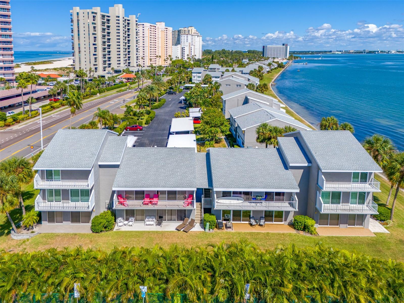 Lovely Sand Key condo, in south Clearwater Beach area. NOT FLOODED or affected by the storms. Built on a berm with block construction which created protection. Flood zone X500. Cute & Cozy 2 bed, 2 bath 1,118 sq. ft. condo with a great open floor plan. Attractive consistent tile flooring throughout giving the space a clean, expansive feel. Kitchen has antique light cabinets with granite counter tops. Newer large Washer/ Dryer in kitchen. Multiple sliding doors have been replaced this year with high impact sliding door. Also, replaced the windows in both bedrooms. The spacious patio facing south offers a partial view of the intra-coastal waterway and a beautiful hedge for privacy. New Water Heater and HVAC is a few years old. Your assigned carport parking space is 'H'. It's just a short walk across the street to access the beach to enjoy the water with the SUGAR SAND BEACH. Move-in ready—just bring your belongings and start living the Florida dream!
Restaurants and shops right around the corner and of course the inviting Clearwater Beach hotels, restaurants and shops are just over the bridge.