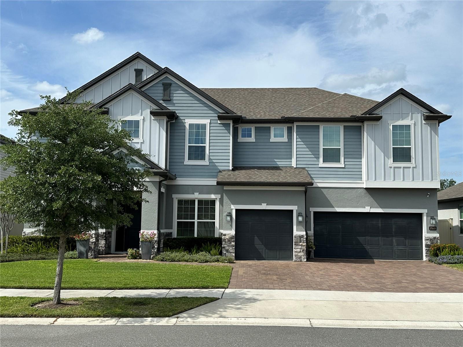 Exceptional Living Awaits in the Heart of Winter Park
Nestled in the sought-after community of Waters Edge at Hawks Crest, this stunning
4268 square-foot energy-efficient home offers an exquisite blend of classic elegance
and modern comfort. This Kerville II model, built by Meritage Homes in 2020, has been
thoughtfully designed to be both welcoming and refined.
From the moment you step through the front door, you’ll be captivated by the quality
craftsmanship, thoughtful upgrades, and inviting spaces that make this home truly
special.
At the heart of the home is a chef-inspired kitchen, beautifully appointed with custom
cabinetry, granite countertops, and a large center island that doubles as a breakfast bar.
Stainless steel appliances make meal preparation effortless and enjoyable. Ample
storage space, a butler’s pantry along with a sunlit breakfast area complete this culinary
haven.
The spacious family room flows seamlessly from the kitchen, featuring large sliding
glass doors that open onto the private backyard oasis with the screened lanai and
heated pool. The main floor also features a private en-suite bedroom with its own
bathroom that offers direct access to the pool.
Upstairs you will find four generous sized bedrooms and three full bathrooms. The
luxurious master suite is a true retreat. Here, you’ll find an oversized dressing room/
walk-in closet, a newer spa-inspired en-suite bathroom complete with built ins, dual
vanities, and a frameless glass shower. The additional bedrooms are spacious and
bright, all with walk-in closets. Also featured on this level is the 6 th bedroom transformed
into a dedicated home office which offers a quiet workspace and the versatile bonus
room which can be tailored to fit your lifestyle—whether as a playroom, media center, or
fitness studio.
Waters Edge at Hawks Crest is a gated community featuring a resort style clubhouse
with pool, fitness center, playgrounds, dog park, fishing dock and access to Lake Howell
Don’t miss your chance to make this your forever home!