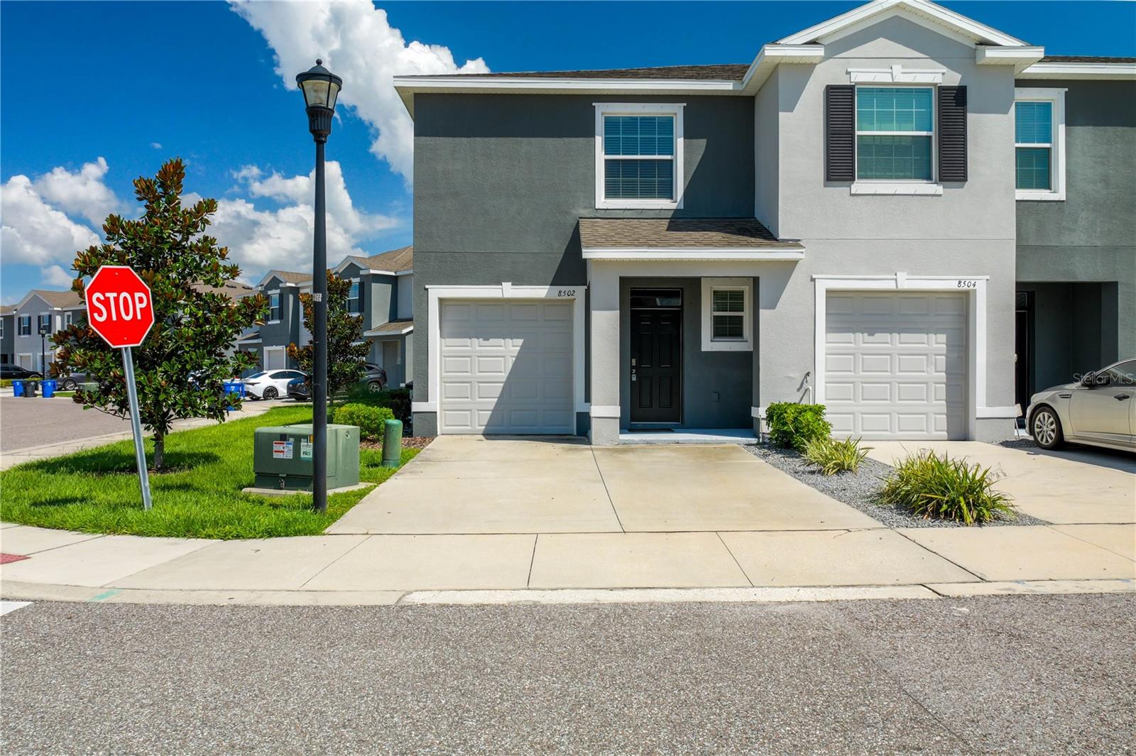 Welcome to this beautifully maintained 3-bedroom, 2.5-bath townhome! The spacious kitchen overlooks the living room and is ideal for entertaining, featuring a large island with bar seating and a generous walk-in pantry. Sliding doors off the living room open to a retractable screened lanai, providing a seamless indoor-outdoor living experience. A convenient half bath is located on the first floor for easy access. Upstairs, the primary suite offers two walk-in closets and a private ensuite with dual vanities. Two additional bedrooms share a full bath, and the laundry room is thoughtfully located on the second floor for your convenience.
Additional features include a 1-car garage, driveway parking for two more vehicles, and nearby guest parking. Conveniently situated just minutes from I-75, downtown Tampa, Brandon, the airport, and within easy reach of St. Pete's beaches, this home is in a prime location. It is equipped with a home security and smart technology system for your peace of mind.