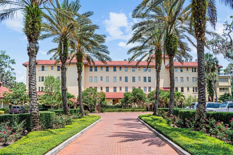 A Jewel Box: Curated for a Life Well Lived. Penthouse 404 at The Alabama is a rare architectural gem—a two-story residence that blends historic provenance w/ design-forward luxury in the heart of Winter Park’s most coveted lakefront setting. Created by combining two original top-floor units, this expansive penthouse is the largest in the building & the only one w/ a private outdoor terrace. Originally constructed in 1921 as the Alabama Hotel, the Mediterranean Revival structure has been transformed into an intimate community of 19 private residences overlooking Lake Maitland w/ direct access to the Winter Park Chain of Lakes. Reimagined by Z Properties in 2019 w/ a full renovation, the home reflects thoughtful scale, bespoke craftsmanship & a sophisticated design vision. The dramatic entry foyer features extensive millwork paneling that conceals the bedroom suites & opens into a light-filled great room w/ expansive lake-facing windows & French doors that open to the signature terrace: a professionally landscaped outdoor retreat w/ turf grass, mist fans, lighting, irrigation & custom planters. At the heart of the home, the boldly composed kitchen balances sculptural form & high function. A sculptural block of black quartz anchors the island w/ seating, trimmed in gold metal cladding that echoes the gold countertops & full-height backsplash. Sleek, dark wood, high-gloss cabinetry conceals a panel-ready Thermador suite, including double refrigerator columns & dishwasher. Lacquered finishes, under-cabinet lighting, geometric black-&-white tile, designer fixtures, brass Lutron controls, linear HVAC diffusers, LED recessed lighting & in-ceiling Sonos speakers complete the experience. What appears to be cabinetry is actually a hidden door leading to a den/family room at the rear of the home—overlooking the lake & appointed w/ custom built-ins, black sisal carpet & a moody grasscloth ceiling that mirrors the wall color & adds cinematic ambiance. Throughout, curated materials elevate each room: Venetian plaster, Schumacher wallpaper, signature lighting, oak chevron-patterned hardwood floors & tailored sisal carpets. The main level includes two en-suite bedrooms located just off the foyer. The primary suite offers a lacquered accent wall, boutique-style closets & a spa-quality bath w/ a custom vanity, dual undermount sinks, lucite-&-metal hardware, black quartz counters & full-height mirrors w/ integrated lighting. A glass-enclosed wet room w/ soaking tub & rain shower, Toto toilet & Venetian plaster walls completes the suite. A discreet laundry room & storage area are tucked away nearby. The secondary bedroom features a black vanity w/ gold hardware, black-&-white subway tile, gold sunburst mirror & a walk-in frameless glass shower—ideal for guests or extended stays. Upstairs, a third en-suite bedroom offers treetop & lake views, a mirrored gym wall & private bath featuring a black vanity w/ silver-toned hardware, black quartz top, black penny tile floors & bold geometric tile that spans the shower & vanity wall—complete w/ a tucked-away water closet for added privacy. Additional features include Nest-controlled dual HVAC, 80-gallon stainless water heater w/ booster, Everpure filtration, Jeld-Wen impact-rated windows & doors, Lutron controls & two reserved covered parking spaces. The Alabama offers a lakeside pool, renovated clubhouse, private dock & community boat slips—all just minutes from Park Avenue.