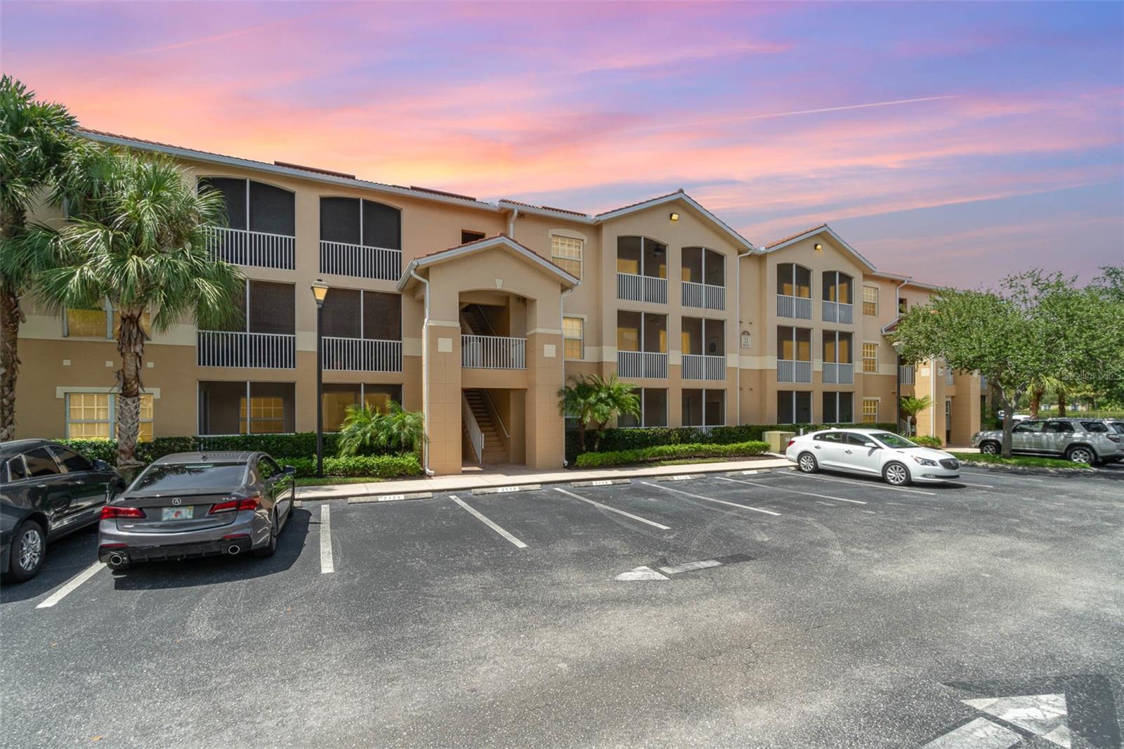 Welcome to Unit 2120 at The Enclave at College Pointe—a bright and well-maintained 2-bedroom, 2-bath condo located on the top floor of a peaceful, gated community in Fort Myers. With just over 1,000 sq ft, this is one of the largest units in the complex. Featuring soaring vaulted ceilings, and a practical open-concept layout that’s ideal for comfortable living or investment income. Home is now vacant. The kitchen includes generous cabinet space, a breakfast bar, and all major appliances. Step out onto the private screened balcony and enjoy quiet courtyard views with morning coffee or an evening breeze. The primary bedroom offers a walk-in closet and private en-suite, while the second bedroom and full bath add space for guests or a home office. A detached garage is available under a separate deed and cost—a unique advantage in this community! Low HOA fees ($366/mo) include access to two heated pools, a spa, clubhouse, gym, business center, pet park, and more. All just minutes from RSW Airport, Gulf Coast Town Center, Edison Mall, and Lakes Regional Park. Whether you're retiring, buying your first home, or adding to your portfolio, Unit 2120 checks all the boxes. Get in for your showing - at this price it won't last long!