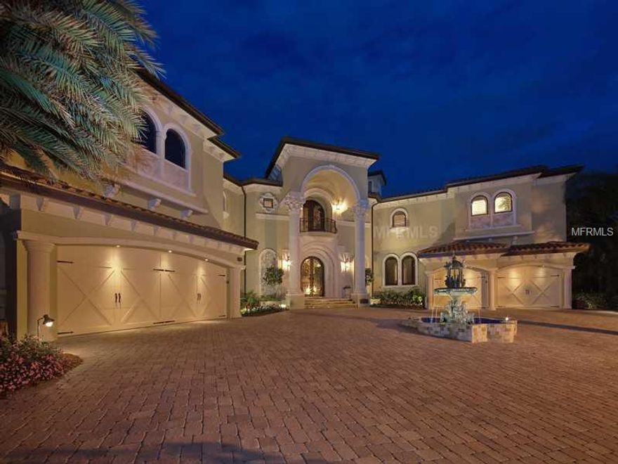 If you migrate toward quality, perfection and attention to detail, you will appreciate all that this fine estate offers. "Isle of View" is positioned on a prime Bird Key bay front lot providing unmatched panoramic views of Sarasota bay, city skyline and the dramatic John Ringling Bridge. This custom home is perched 14 feet above its 300' seawall and offers over 7800 square feet of spectacular living space. The largest yachts that are able to navigate Sarasota waters can dock in the deep water at this Mediterranean style residence without obstructing the expansive views. Inside you will find 5 bedrooms, 5 full baths, 2 half-baths, a 3-stop elevator, culinary kitchen, home theatre for 10 viewers, expansive game room with "creative bar", and library/office.Please request our 30-page catalogue for further details.