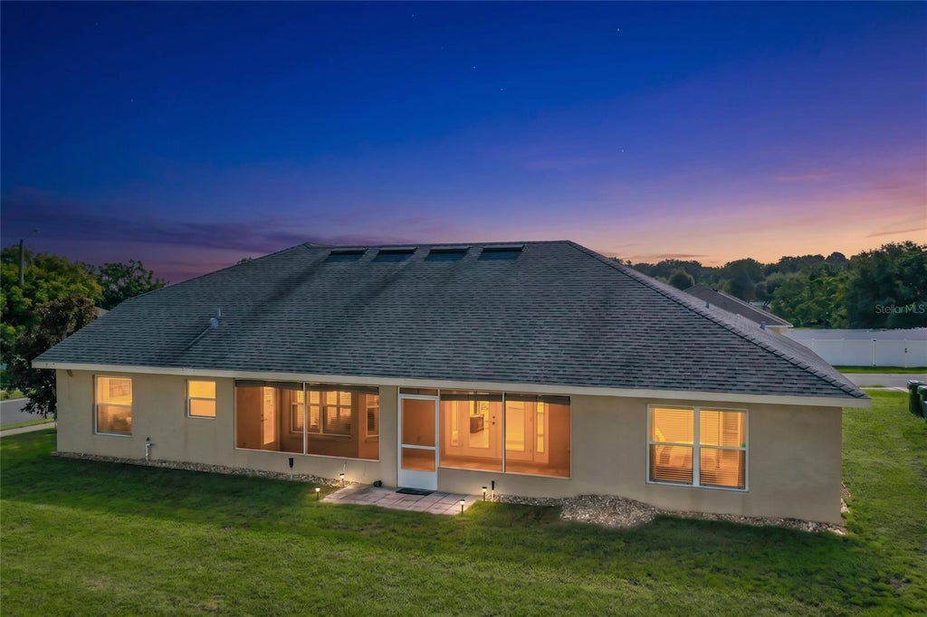 Photo of 301 Ashton Woods Lane, Leesburg, FL 34748 (MLS # O6451096)
