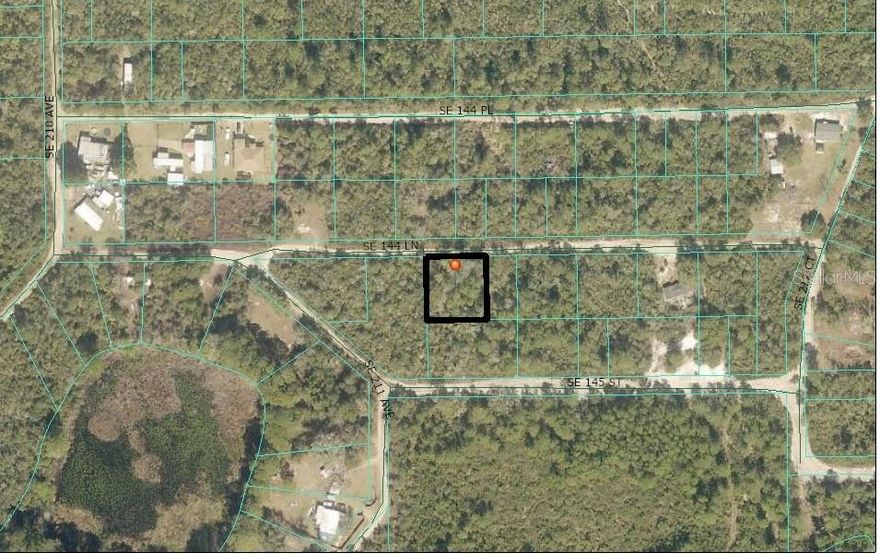 .23-acre lot zoned R4, ideal for residential, multi-use development, or mobile home. Sister property is also available for expanded potential.