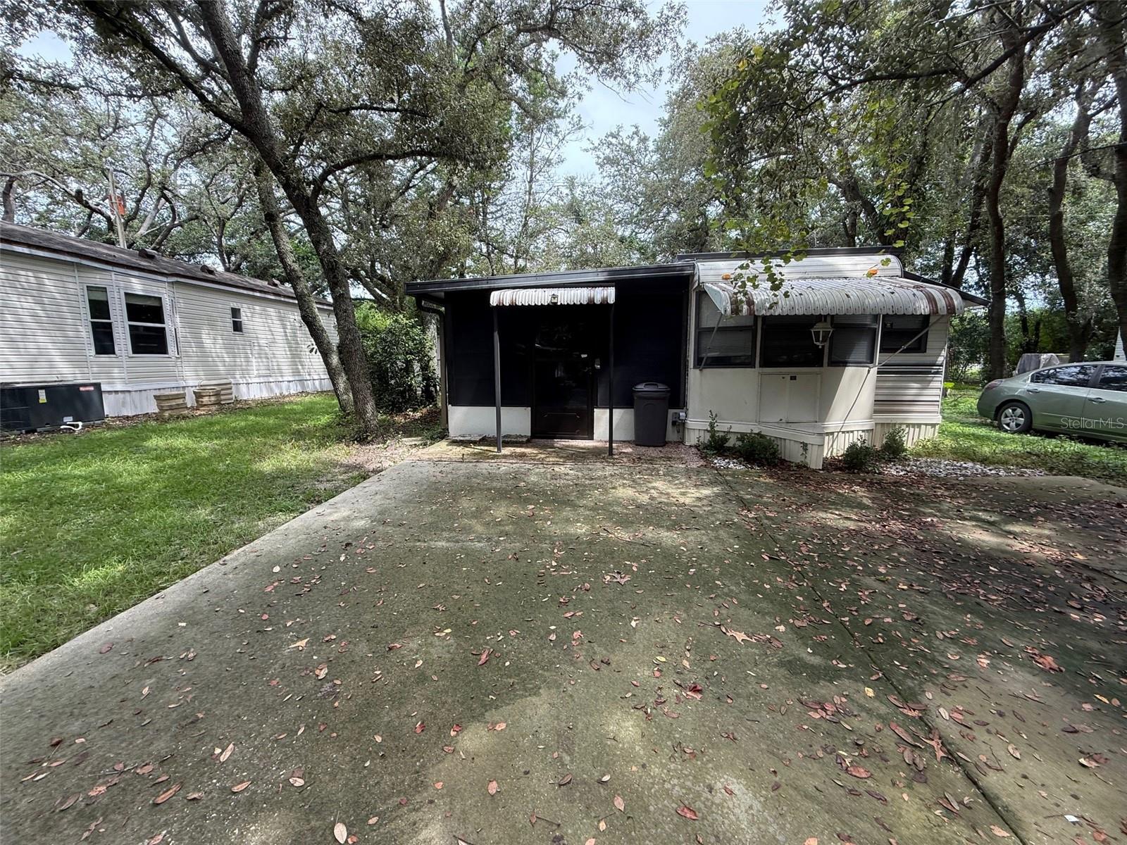 1 bedroom 1 bath park model home with large, enclosed Florida room. Ready to move in. Hardwood flooring and carpet throughout. Parking for two in the front, open patio in the rear with utility shed featuring washer and dryer hook ups. Rent includes water, sewer, trash pickup, 24/7 virtual gatehouse, 110,000-gallon Pool, On-Site Condo office and Management. This home is right off of Clarcona Rd with quick access to 441, 414, 436, 429, I4, Lake Apopka, Wekiva Springs State Park, shopping, dining, entertainment, and more.