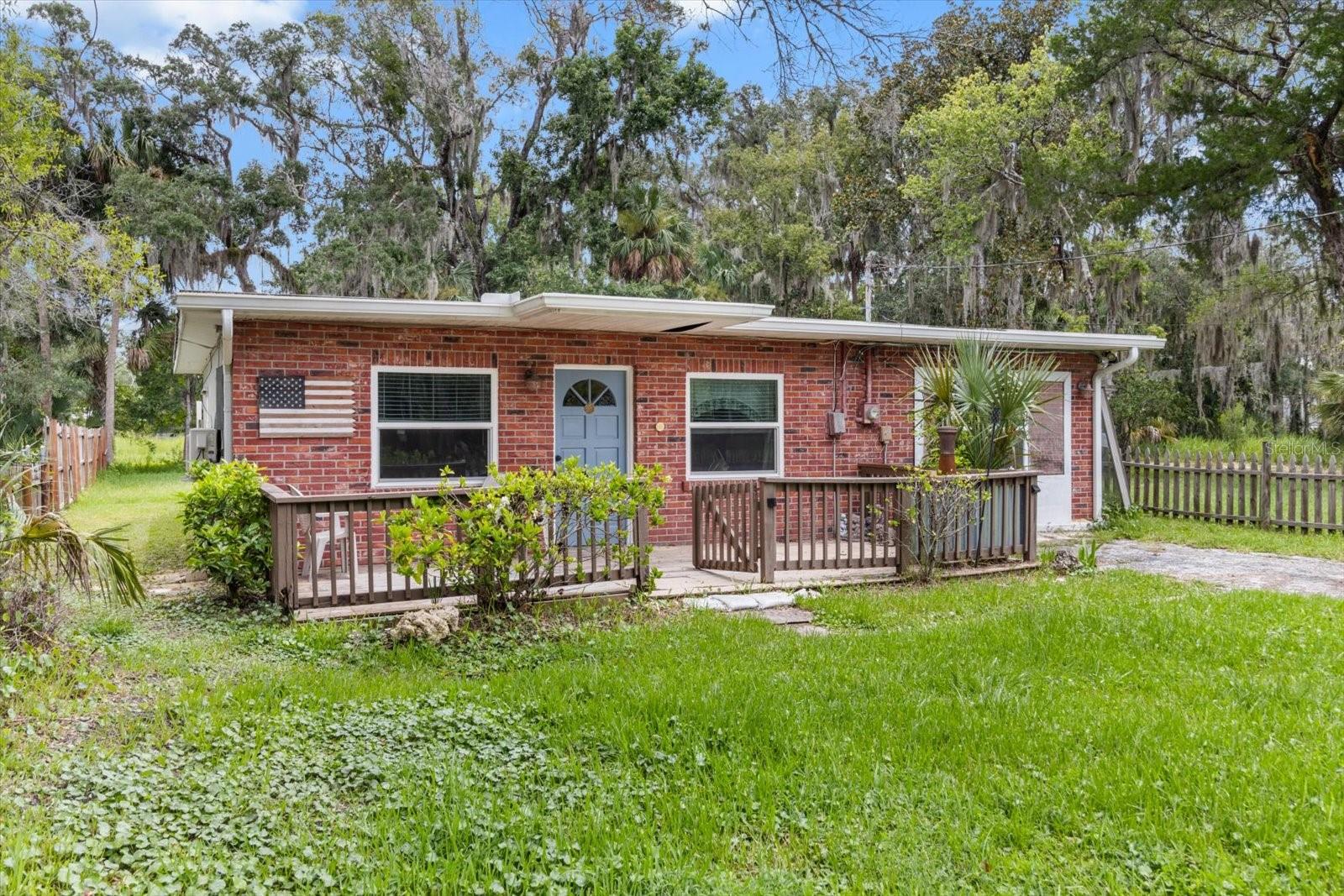 This charming 3-bedroom (or 2 bedroom with a flex space), 2-bathroom CONCRETE BLOCK home offers 1,110 square feet of comfortable living space and is located in the heart of the City of Crystal River. Though the home previously experienced flooding, all necessary repairs have been completed, making it fully move-in ready! Inside, you'll find brand-new appliances, new cabinetry, upgraded windows, and a spacious living area. Two efficient mini split units provide cost-effective cooling throughout the house. Outside, the fenced backyard backs up to a peaceful wooded area and features a tree swing, a shed with an overhang for additional storage or workspace, and a 12x30 concrete slab back porch perfect for relaxing. You'll also enjoy the added bonus of your very own orange trees, bringing a touch of Florida charm right to your backyard. The location is unbeatable and within walking distance to historic Citrus Avenue, where popular events like the Manatee Festival, Stone Crab Jam, and First Fridays take place. Enjoy waterfront dining, boutique shopping, the scenic boardwalk, and nearby Hunter Springs for kayaking or swimming with the manatees. All three public schools are just a short walk away. Whether you love boating, fishing, scalloping, or simply soaking up the charm of the Nature Coast, this home offers the ideal blend of convenience and coastal living with a small-town feel.