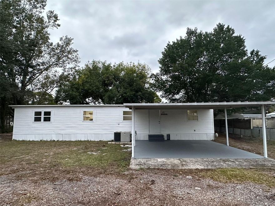 Fully renovated manufactured home, 2 bedrooms, 1 bath, living/dining combo, newer stainless steel appliances, 2 car carport, spacious backyard, back screened in covered porch, laundry / storage area and a 3rd room with an independent AC that can be accessed from the porch and can be used as a 3rd bedroom / flex.  Close to the chain of lakes, Dora Canal, shopping, restaurants and main roadways.  Available now.