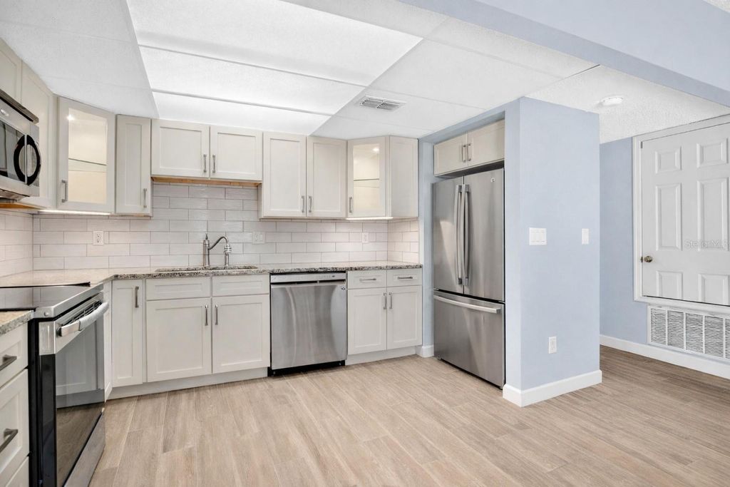 Photo of 5656 Royal Pine Boulevard #27, Orlando, FL 32807 (MLS # O6384013)