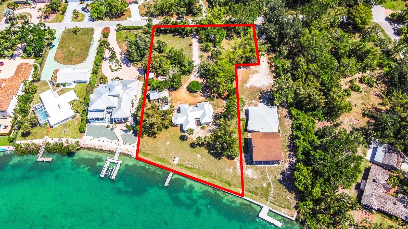 Bring your builder to this incredible bay front lot measuring 1.13 acres in picturesque Nokomis Florida! Views of the bay framed by mangrove islands beyond give you an unbelievable view of nothing but water and nature. Imagine waterfront living with your boat at your private dock right in your own back yard adjacent to the Intracoastal Waterway and just minutes to Venice Jetty parks and the open waters of the Gulf of Mexico through the Venice Inlet. There is a concrete seawall that runs along the entire water's edge and an old existing dock. The soft sugar sands of Nokomis Beach and the tranquil turquoise waters of the Gulf of Mexico are 2 minutes away. Walk, jog, pedal or drive, you're .4 miles to the beach either way you choose to get there! Enjoy waterfront dining or a tropical libation at Pop's Sunset Grill or Pelican Alley, literally right around the corner. Marinas and boat/jet ski rentals are located here too. Have a fun day at the beach or on the water then retreat home to your quiet sanctuary where time seems to stand still. Check with Sarasota south county zoning to see if the property has the ability to be split into two half acre parcels. There is an original 1951 built 2/2 home and 3 out buildings on the property. This is a once in a lifetime opportunity so schedule your private showing today!