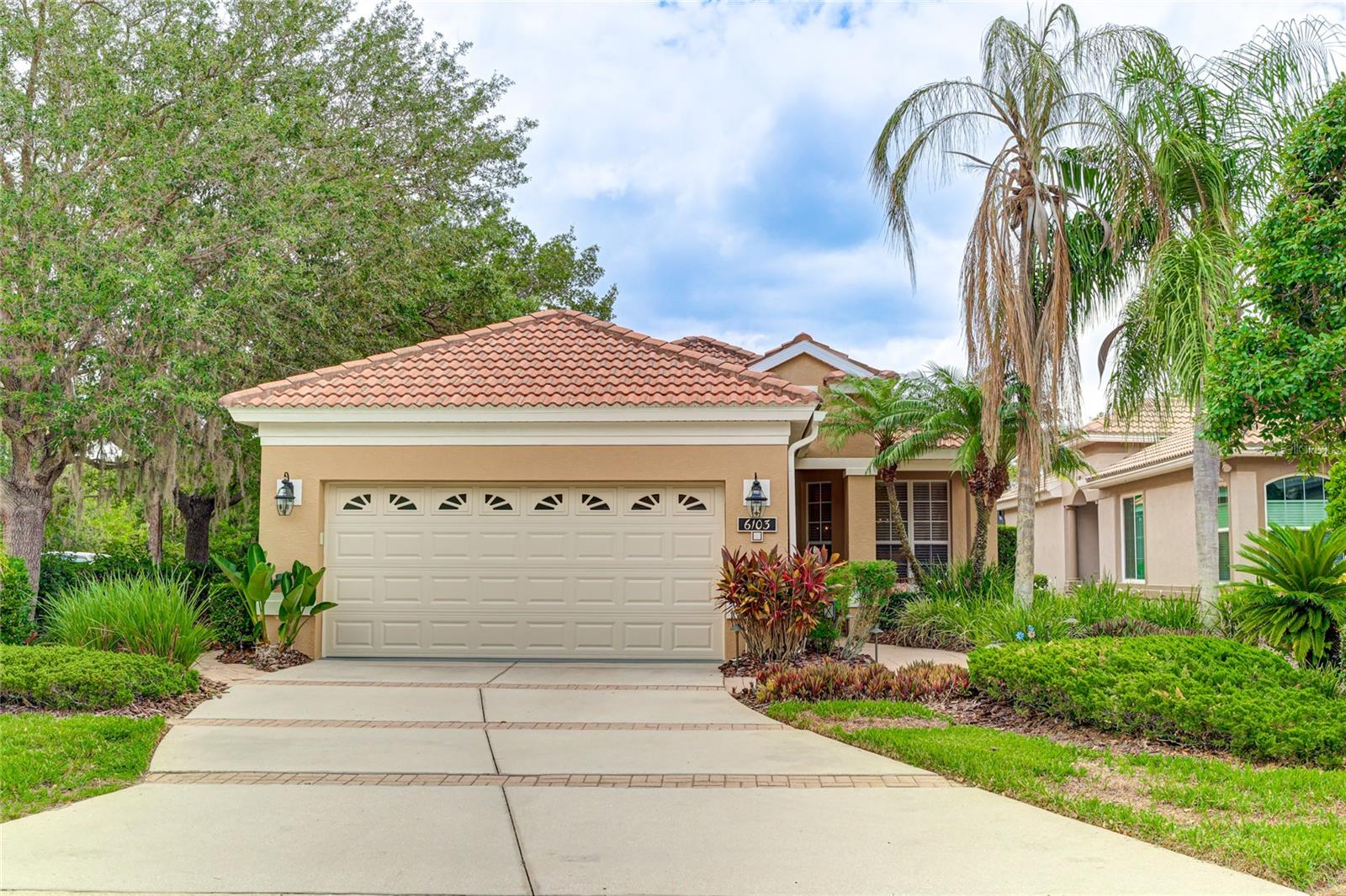 Exceptional opportunity in the sought-after community of Tara Preserve. This beautifully maintained home features a brand-new tile roof (April 2025), offering peace of mind for years to come. Inside, enjoy a blend of thoughtful updates and inviting style, including a new AC (2024), water heater (2024), and garage door with opener. The freshly painted exterior is complemented by new coach lights and landscape lighting, creating a warm and welcoming first impression. Step into a spacious, open floor plan with freshly painted interior spaces, new LED lighting, updated ceiling fans, and stylish fixtures in the dining room and kitchen. The kitchen also features a new farmhouse sink, faucet, and soft-close cabinet hinges for added functionality. A whole-house surge protector adds an extra layer of protection, while the primary bath has been updated with a new commode and frameless shower door. Additional upgrades include new smoke detectors for peace of mind. Outside, relax on your re-screened lanai with terra cotta patio flooring—a perfect setting for morning coffee or evening unwinding. Tara Preserve offers a low-maintenance, resort-style lifestyle with golf (no membership required), community pool, tennis, pickleball, cable, internet, and lawn care included—all with an extremely low HOA fee. Plus, it's pet-friendly with no weight or breed restrictions. With seller concessions available, this move-in ready home is an opportunity you don’t want to miss.
