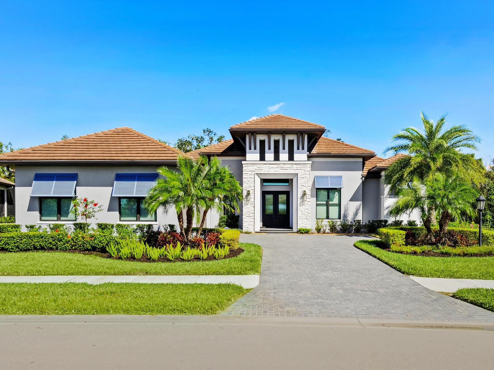 Price reduction on the largest executive lot,16,885 square feet, in all of Skye Ranch, this stunning Nelson Homes by Arthur Rutenberg home is pride of the community. The Trieste model home has everything for the discerning buyer. The home comes with hurricane-impact windows, doors and a 24-kilowatt Generac generator that services the whole home. At 3,396 square feet under air, the Trieste features an exquisite, oversized kitchen with gas cooking, plenty of bar area for friends and family and is well positioned to take in the stunning private outdoor living space complete with a firepit, pool, spa, outdoor kitchen, panoramic screening, ample covered space and intimate fireplace retreat off the primary bedroom complete with a TV. Enjoy privacy with no properties behind you. Disappearing sliding doors allow rooms to seamlessly flow together. The primary bedroom has engineered wood flooring, two walk-in closets, a free-standing tub and dual vanities. The home is ideal for entertaining as the living, dining area that can seat up to 10, and kitchen are all connected. The split plan guest bedrooms have their own private enclosed patio area off the kitchen. There is a spacious office near the front of the home and there is a large bonus room 18-by-15 feet off the kitchen. The owners have done many upgrades to the home. Upgrades include new engineered flooring throughout the home, generator, new pool pump, filter and salt cell in 2024, garage floor painted, new electric blinds and new landscaping. As a bonus, the seller has paid off the CDD tax and this will save almost $2,500 a year for the new owner for the life of the bond. The home also comes FURNISHED!! The HUB, a state-of-the-art community center, is just down the street. The center includes a community pool, basketball courts, gym, bar, conference rooms, tennis and pickleball courts. The community also includes a playground and lots of trails. Easy to show and the seller is flexible on closing. Make your appointment to see this unique home.