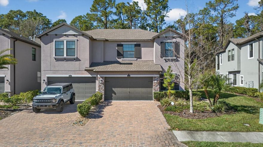 This spacious end unit townhome offers a thoughtful two story layout in the highly sought after Estancia at Wiregrass community. With 1,852 square feet, 4 bedrooms, 2.5 bathrooms, a 2 car garage, and a private side entry, the home combines functionality with comfortable living in a prime Wesley Chapel location.

The main level is designed for gathering and entertaining, featuring an open concept layout where the great room and dining area connect seamlessly to the kitchen. The kitchen is well appointed with a large center island, quartz countertops, 42 inch cabinetry, satin nickel hardware, and stainless steel appliances. Tile flooring throughout the first floor adds durability and ease of maintenance.

The owner’s suite is conveniently located on the first floor and includes a large walk in closet and an en suite bathroom with dual vanities and an oversized walk in shower.

Upstairs, three additional bedrooms are joined by a full bathroom and a spacious loft that works well as a second living area, home office, or flex space.

Estancia at Wiregrass offers an amenity rich lifestyle that stands out in the Wesley Chapel area. Residents enjoy a zero entry resort style pool, a heated junior Olympic size pool, and a two story water slide tower. The Estancia Club serves as the centerpiece of the community with its 7,000 square foot clubhouse, elegant club room, meeting space, and a state of the art fitness center. Walking trails, parks, and recreational spaces are located throughout the neighborhood.

Ideally situated near major roadways and everyday conveniences, this location provides quick access to Wiregrass Mall, Tampa Premium Outlets, The Grove, AdventHealth Wesley Chapel, dining, entertainment, and more, with an easy commute to downtown Tampa and Tampa International Airport.