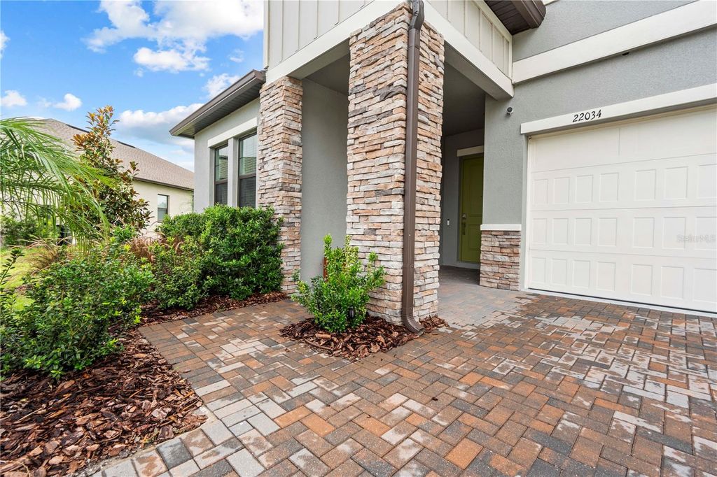 Photo of 22034 Storybook Cabin Way, Land O Lakes, FL 34637 (MLS # TB8404043)