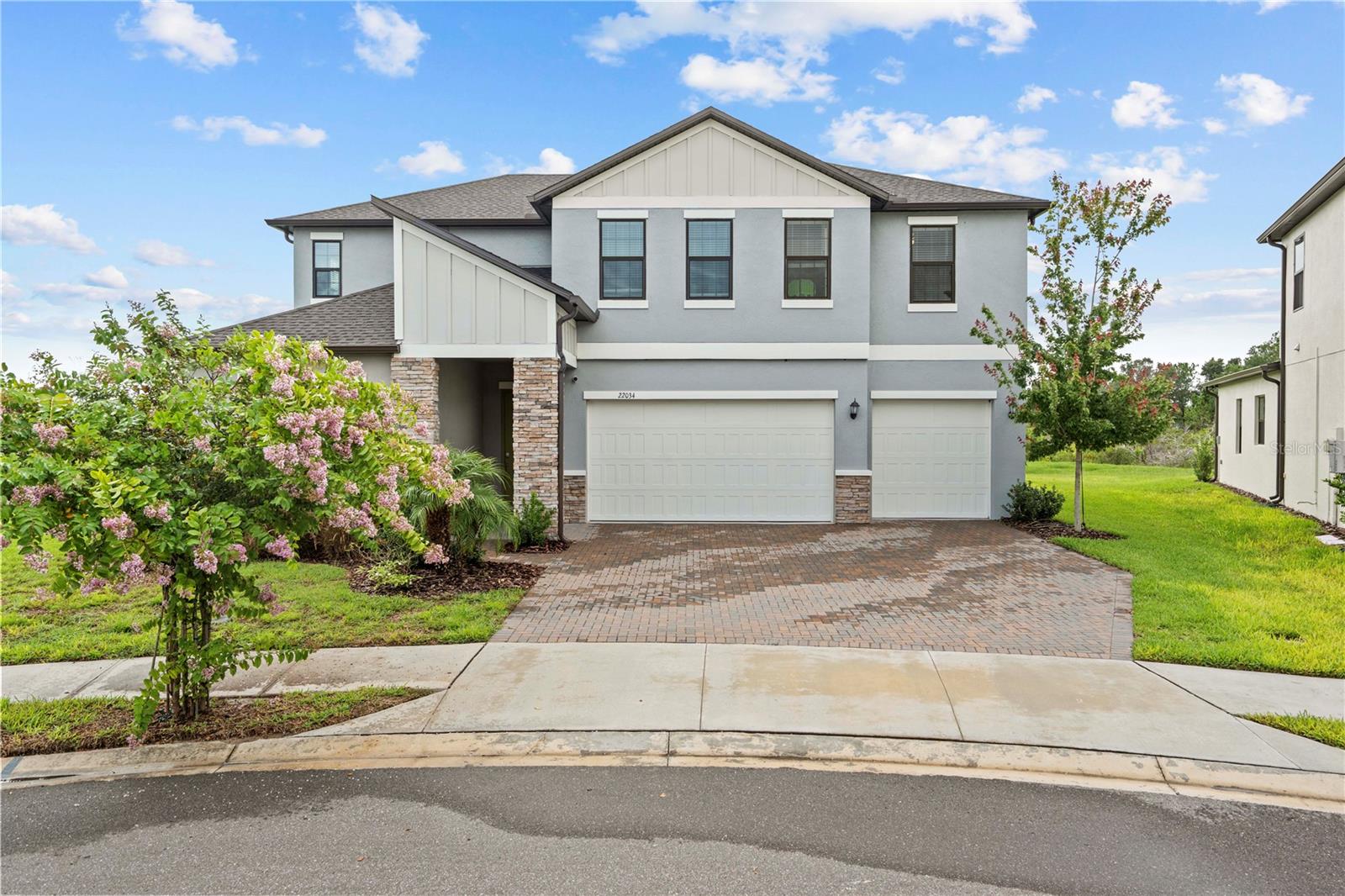 Welcome to your dream home in the heart of Connerton! This above standard 5 bedroom, 4 bathroom home is an impressive 3,629 square feet of luxurious living space, perfectly blending comfort, style, and functionality. Priced for immediate occupancy, this home is located in one of the most sought-after master-planned communities in Land O’ Lakes. From the moment you arrive, you’ll be captivated by the home’s elegant curb appeal and spacious layout. Inside, you’ll find high ceilings, abundant natural light, and modern finishes throughout. The open-concept kitchen boasts granite countertops, stainless steel appliances, and a large center island — perfect for entertaining. The expansive primary suite features a spa-like bathroom with dual vanities, a soaking tub, and a walk-in shower. With five generously sized bedrooms and four full bathrooms, there’s plenty of room for family, guests, and a home office or media room. The backyard offers ample space for a future pool or outdoor oasis. As a resident of Connerton, you’ll enjoy access to resort-style amenities including a community clubhouse, pool with splash zone, fitness center, walking trails, and community events, all available in a beautiful natural preserve setting. Don’t miss this opportunity to own a piece of paradise in Connerton. Schedule your private showing today!