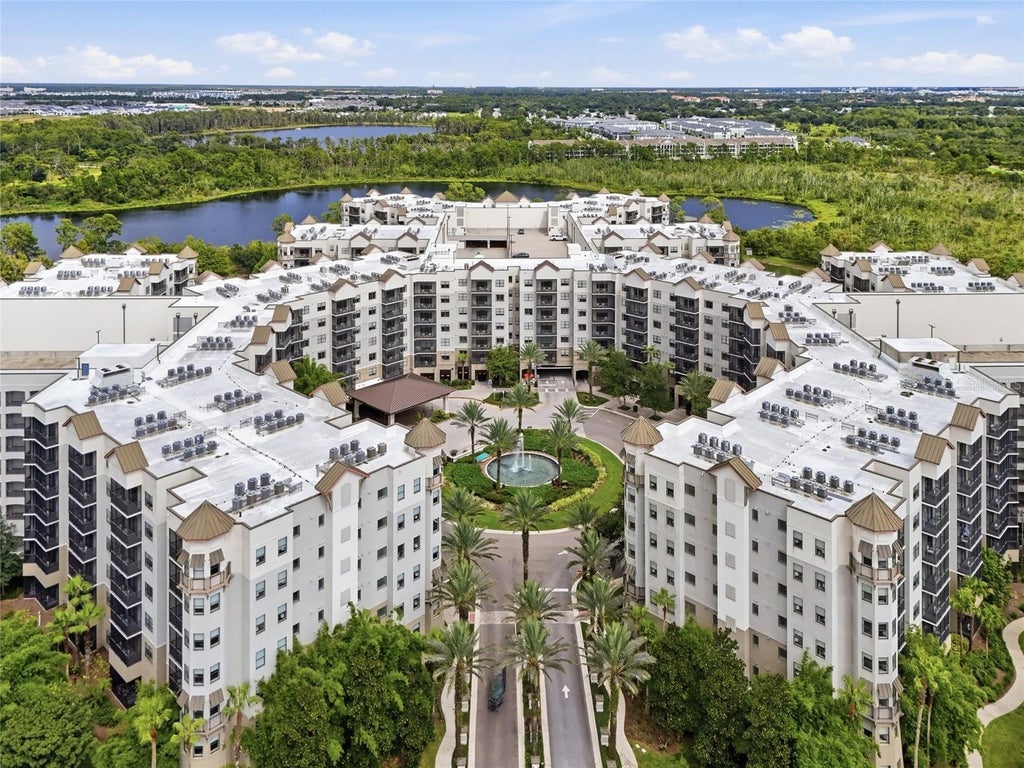 Photo of 14501 Grove Resort Ave #2304, Winter Garden, FL 34787 (MLS # O6447002)