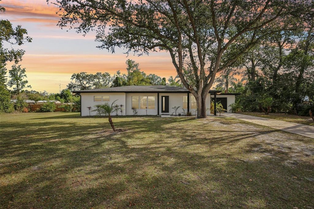 Photo of 12809 N Blvd, Tampa, FL 33612 (MLS # TB8461197)