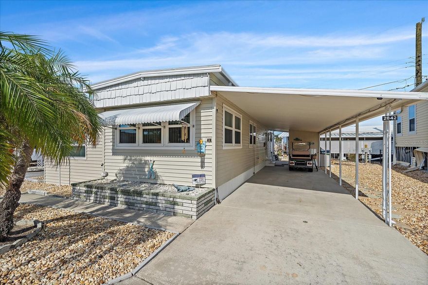 DREAMING of a WATERFRONT community LIFESTYLE?  Your perfect retreat awaits, blending the tranquility of coastal living with the energy of a vibrant community. Whether you're seeking a WINTER ESCAPE or a YEAR-ROUND HOME, this 2-bedroom, 1.5-bath gem is IDEAL.  Located in the LAND OWNED area of Tropic Isles, a 55+ active community, it offers everything you need. This community is a haven for those who enjoy staying active. Engage in friendly games of shuffleboard, cards, or enjoy a relaxing day on the water with friends.  Shopping malls, restaurants, and medical facility's just minutes away. Easy access to I-75. Explore Sarasota and visit University Town Center Mall, St. Armand's Circle, Selby Botanical Gardens, and the Ringling Mansion & Museum of Art and our beautiful Gulf Beaches. WITH LOW HOA OF $100/YEAR, WHY WAIT?.  Check virtual tour and/or schedule your private showing today. 
*HVAC is not in service. **Golf cart does not convey.