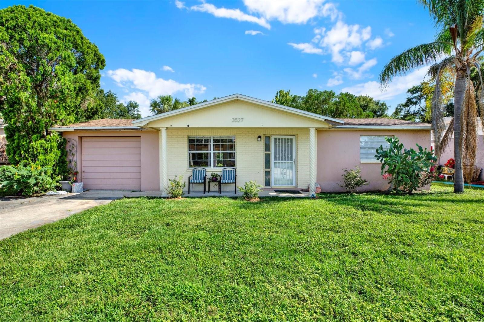 Welcome to your serene oasis! This charming 2-bedroom, 1-bath home features a spacious 1-car garage and an inviting open kitchen with stainless steel appliances. The highlight of this property is the Florida room, perfect for relaxing with a good book or enjoying a quiet afternoon surrounded by nature. This screened-in space is ideal for your favorite plants and offers a peaceful view of the backyard. Speaking of which, the backyard is a true retreat with a variety of fruit trees, including a banana tree, and meticulously manicured grass. The chain-link fence provides both security and a clear boundary for your outdoor activities.
Located in a friendly neighborhood with sidewalks, you can enjoy morning jogs or evening strolls with ease. Plus, you’re just under 3 miles from Anclote Park and the famous Sponge Docks, offering endless opportunities for outdoor fun and local exploration.
Additionally, peace of mind comes standard with an A/C, roof, and water heater all under 4 years old. Don’t miss out on this exceptional home that combines comfort, convenience, and tranquility.
