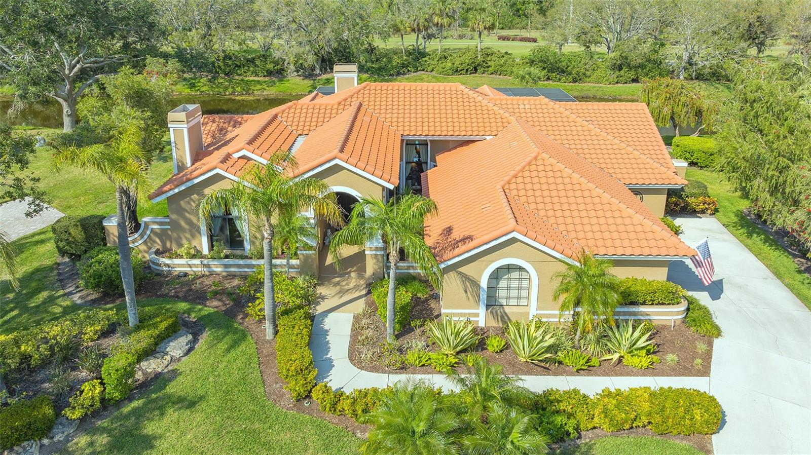 Huge $100k price improvement, grab this amazing home while you can !! Welcome to 4221 Escondito Circle, a beautifully designed 3-bedroom, 2.5-bathroom pool home in the prestigious Prestancia community of Sarasota—a highly sought-after gated golf community offering luxury and tranquility. This spacious home features a split floor plan, soaring cathedral and vaulted ceilings, and an inviting layout perfect for both relaxation and entertaining. Inside, tile flooring flows throughout, with plush carpet in the living room, where a cozy wood-burning fireplace adds warmth. A second fireplace in the family room enhances the inviting ambiance. The chef’s kitchen boasts granite countertops, rich cherry wood cabinets, two ovens, and a range, providing ample space for cooking and entertaining. The primary suite offers a huge walk-in closet and an exceptional spa-like bathroom featuring dual sinks, a separate walk-in shower, and a luxurious soaking Jacuzzi tub—perfect for unwinding after a long day. On the opposite side of the home, you’ll find two additional bedrooms along with a full bathroom, providing privacy and functionality for family and guests. Step outside to your private screened-in pool and spa, overlooking a peaceful lake where nature thrives.Golf enthusiasts will appreciate the opportunity to play at TPC Prestancia, featuring two premier 18-hole courses, with optional golf and social memberships available. Nestled in Palmer Ranch, one of Sarasota’s most desirable areas, this home is just 5.5 miles from world-famous Siesta Key Beach and minutes from top dining, shopping, and entertainment.Don’t miss this opportunity—schedule your private tour today!