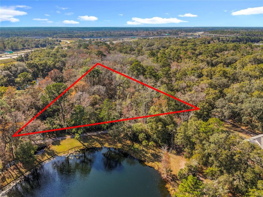 Build your dream home or secure a smart investment on this 1.27± acre vacant residential lot located on Pine Street in Jacksonville, FL 32258. The property is directly across  (7468 Magnolia Rd), providing a clear and recognizable landmark on a quiet residential street with surrounding homes. Jacksonville continues to experience strong population and economic growth, making land ownership an attractive long-term investment opportunity with increasing demand and limited availability of larger parcels within the city. This wooded lot offers privacy while remaining conveniently located near US-1, I-295, and I-95, allowing easy access to Downtown Jacksonville, St. Augustine, and coastal destinations. Nearby attractions include the St. Johns River, local parks, shopping, dining, medical facilities, and approximately a 30–40 minute drive to Jacksonville Beaches. No HOA. Qualified buyers may purchase this vacant lot with as little as 20% down payment.