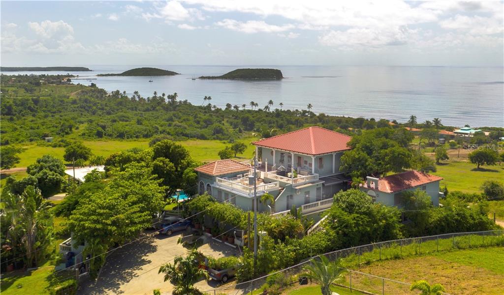 This is your chance to own the longest running and highest rated hotel on Vieques, Hacienda Tamarindo. The owners of this Award-Winning Hotel are now looking to hand over the reins to a new owner, which is a rare and exceptional opportunity.
Perched on a quiet hilltop overlooking Esperanza Bay and its twin cays, Hacienda Tamarindo offers 17 special hotel rooms, a 20x40 foot swimming pool, a spacious owner’s penthouse with spectacular views, a separate casita and 2.8 additional acres. The current owners, specialists in Hospitality and Commercial Interior Design, have done all the hard work of creating this special property, which you can now take over and own.
Hacienda Tamarindo is located on the island of Vieques, Puerto Rico, close to some of the most pristine beaches in the Caribbean, including award winning La Chiva beach in the Caribbean’s largest wildlife refuge. Located on the outskirts of the small village of Esperanza puts this hotel close to restaurants, bars, and shops, while being just far enough away to offer a relaxing retreat with peace and views of the aquamarine waters of the Caribbean Sea.
Snorkeling, horseback riding, beachcombing, and exploring the nighttime marvel of Vieques’ world famous Bioluminescent Bay are just some of the many activities guests enjoy during their visits. A trip to Vieques’ magical Playa Grande is only a short walk away.
Hacienda Tamarindo has been the deserved recipient of many awards over the years, including 5 consecutive Quality Awards from the Puerto Rico Hotel & Tourism Association, named one of The Best Honeymoon Resorts in Puerto Rico, and winner on many occasions of TripAdvisor’s Traveler Choice Award (given to only the Top 10% of hotels in the world). Hacienda Tamarindo is also a member of both “Small Elegant Hotels” and the “Exclusive Island Hotels & Resorts” and is one of only 3 hotels in all Puerto Rico listed in the best-selling guide, 1000 Places to See Before You Die.
Included in this sale is the spacious owner’s Penthouse, consisting of 1200 square feet of privacy with front and rear decks, offering breathtaking views up and down the southside of Vieques. It has one bedroom, one and a half baths, a living/dining area, office, and chef’s kitchen. Vaulted ceilings, woodwork and tile add to the charm of this inviting space.
The hotel consists of 17 rooms, including a separate casita with its own kitchen. There is a kitchen and dining area where guests enjoy morning breakfasts. There is an Air Conditioned library and bar off the open air lobby, with WIFI in all public areas. The 20x40 foot pool has depths up to 8 feet deep and offers water views from the poolside lounge chairs and shaded pergola deck area. The grounds also offer water features, hammocks, tropical plants, and other relaxing amenities.
In addition to the main building, pool and casita, there is an additional 2.8 acres of vacant land, closer to the ocean, that goes with this property. It has water and electric nearby and is suitable for additional development. It has been approved for 8 villas.
This is a rare opportunity in the Caribbean, and one that is now available to you. Please contact us for more info.