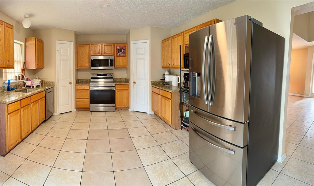 Photo of 510 Lobelia Drive, Davenport, FL 33837 (MLS # O6409101)