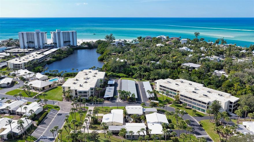 Welcome to your coastal retreat in the form of this secluded, 2 bed/2 bath freestanding villa with one car garage in the premiere GULF FRONT property of Whispering Sands.  OFFERED FURNISHED.  This surprisingly large, 1,462 square foot property has been UPDATED in 2025 with fresh paint, NEW crown molding & baseboards, NEW kitchen and updated baths. The exceptionally large living room allows for multiple seating groups, while a wall of floor to ceiling sliders – treated with beautiful shades - provides an abundance of natural light. Meal prep is easy in your bright NEW kitchen featuring white cabinetry, subway tile backsplash, granite counters, stainless Whirlpool appliances, recessed lighting, fandelier, & vinyl plank flooring. Three sets of new hurricane impact sliders open from the kitchen, dining room, and 2nd bedroom into your private fenced brick paver patio which offers valuable outdoor space for sunny relaxation or effortless entertaining.  Both newly carpeted bedrooms feature an extended living space to accommodate a small seating group, desk, or exercise equipment. The bathrooms have been refreshed with NEW granite countertops, cabinets, vanities & fixtures. NEW 2026 stacked W/D in garage. 2019 HVAC.  Recent enhancements include exterior pressure washing and villa painting in February 2026.  Newly updated brick paver driveway.  New landscaping is being planned by the HOA starting in 2026. Whispering Sands is a premiere 55+ Gulf front property ideally located next to the colorful boutiques and dining options of Siesta Key Village, and offers 800’ of PRIVATE beach, 2 heated pools, new beachside Tiki Hut, grills, shuffleboard, canoe/kayak storage, security, & onsite management. The clubhouse is scheduled to be remodeled in 2026 and when completed will include fitness rooms, catering kitchen, and an elegant and comfortable space for social gatherings.  Seller is willing to include 3 year new KIA SUV automobile with acceptable offer. Your coastal retreat awaits!