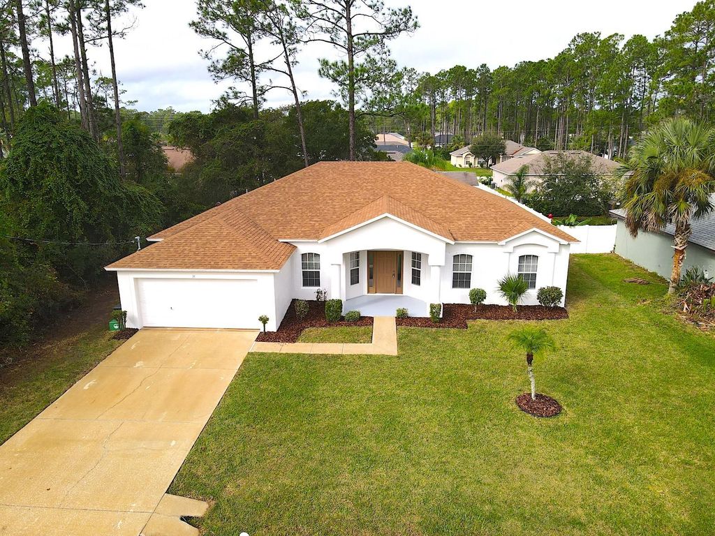 Photo of 36 Ripplewood Lane, Palm Coast, FL 32164 (MLS # FC313701)