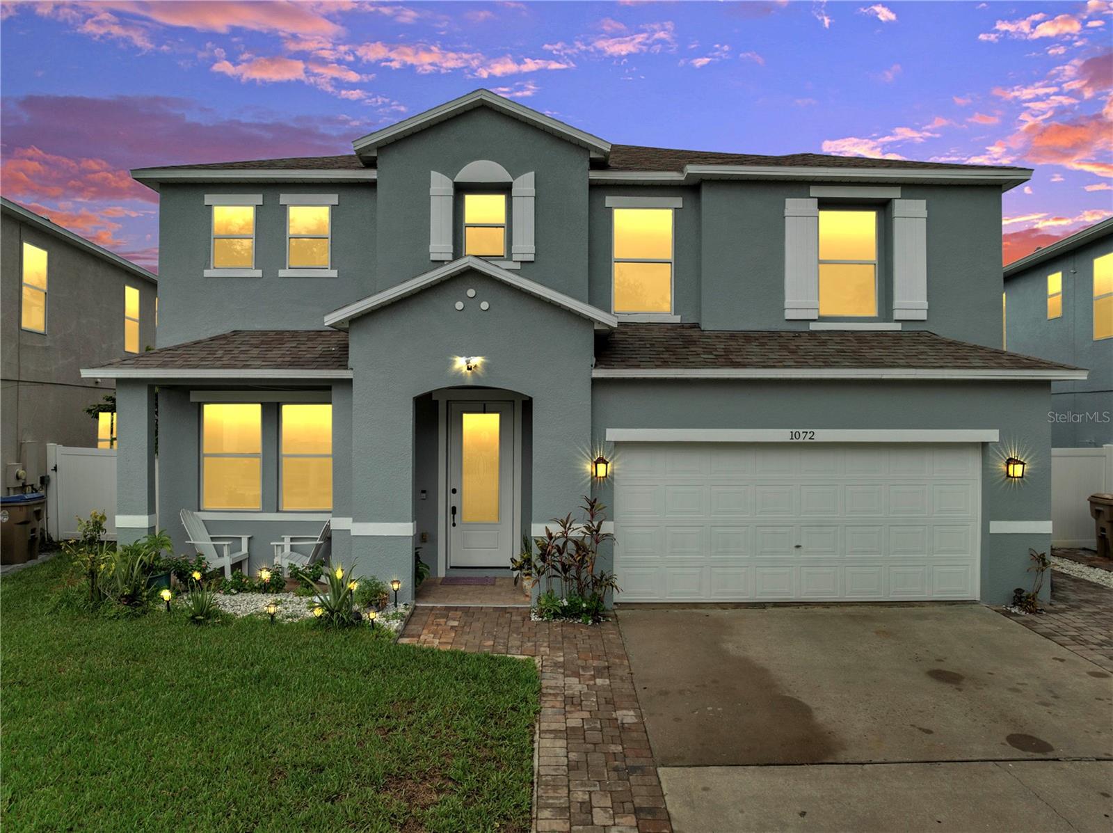 Welcome to this beautifully updated pool home in the highly desirable Remington community of Kissimmee! Featuring 5 bedrooms and 4.5 bathrooms, this property offers a spacious layout with modern upgrades throughout. The first floor boasts vinyl flooring, while the second floor showcases wood flooring, with no carpet anywhere in the home. The main level includes a formal living room, dining room, family room, and an in-law suite with its own full bathroom. The kitchen is a centerpiece of the home, designed with light gray cabinets, stainless steel appliances, and a large island with seating, ideal for cooking, gathering, and entertaining. Step outside to your private retreat featuring an enclosed screened pool and spa, a separate pool bathroom, and a fenced backyard perfect for relaxation or entertaining. Upstairs, the primary suite shines with natural light from four windows, a spacious ensuite bath, and a double walk-in closet. A loft area, upstairs laundry, and another bedroom with its own full bath add to the home's functionality. Additional features include a 2023 roof, 2020 AC, water filtration system, sprinkler system, paved driveway, 2-car garage, paved patio, and fresh interior paint. Living in Remington means enjoying resort-style amenities including a golf course, community pool, recreation center, baseball and soccer fields, basketball and tennis courts, sand volleyball, and a walking and fitness trail, all in one of Kissimmee's most sought-after neighborhoods. This move-in-ready home combines comfort, upgrades, and community living in one incredible package.