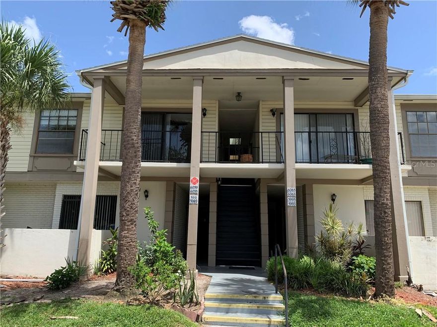 MOVE IN READY!! Renovated... New hardwood flloring instaled...Freshly painted.... ground floor unit with a private parking space, directly across from the laundry center, pool and tennis court. The living room has oversized windows to let the natural light in and sliding doors that led into a porch. Two large walk in closets and an additional outside storage. This community is minutes to downtown Orlando, Orlando International Airport, shopping and restaurants. Come see this Condo today, it won't last long!