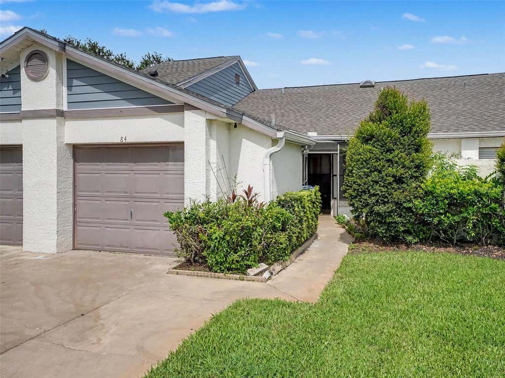 Photo of 84 Lakepointe Circle, Kissimmee, FL 34743 (MLS # O6435248)