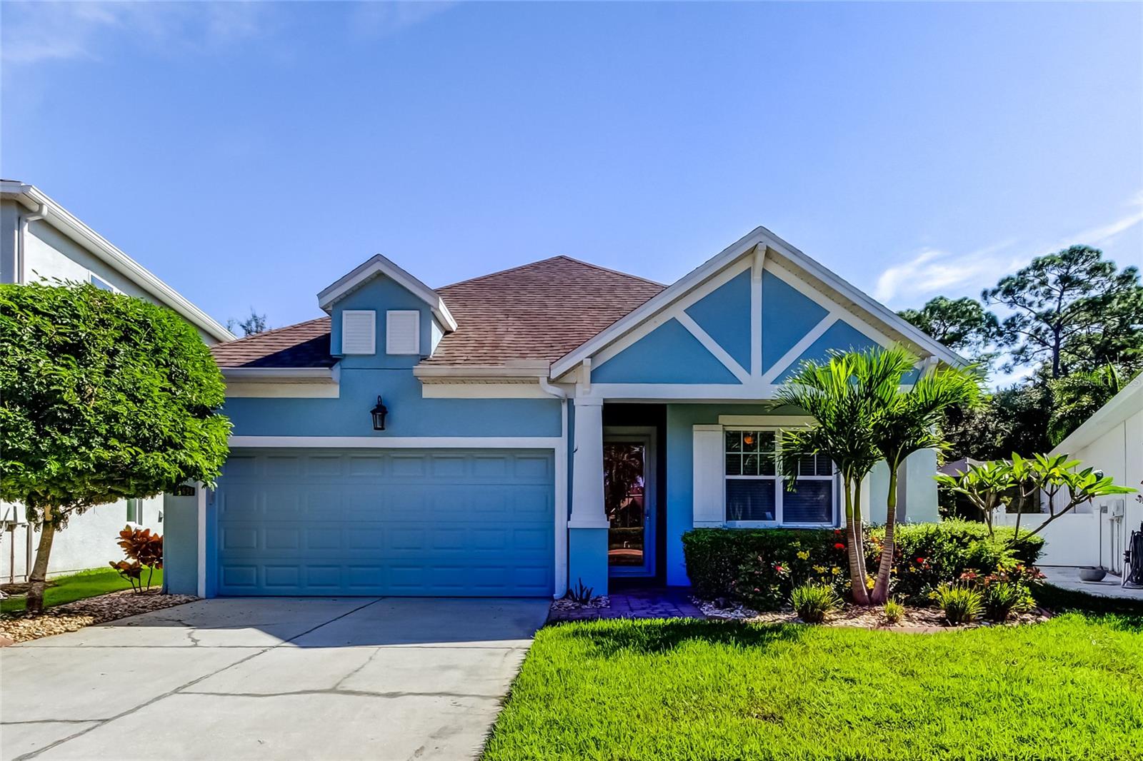 Welcome to this beautifully maintained 3-bedroom, 2-bath heated pool home situated on an oversized, private cul-de-sac lot in the highly sought-after Champions Forest community. This open-concept floor plan features a stunning kitchen with stainless steel appliances, a spacious center island, granite countertops, tile backsplash, and 42" wood cabinetry.
Elegant ceramic tile flows throughout the main living areas, while all bedrooms offer warm wood flooring—no carpet anywhere. Tray ceilings, crown molding, and custom window treatments add an elevated touch of style and sophistication. The spacious first-floor primary suite boasts serene views of the backyard oasis and pool, along with a luxurious bath complete with dual vanities, a walk-in shower, and a large walk-in closet. Two additional guest bedrooms are tucked at the front of the home for privacy, with one also featuring a walk-in closet.
The French door leads you outside to your Florida retreat! The backyard offers a large covered patio with pavers, a sparkling pool, and plenty of private yard space surrounded by lush tropical landscaping. Additional features include energy-efficient double-pane windows and hurricane shutters for peace of mind. New HVAC 2020 & New Pool Pump 2020.
Champions Forest is ideally located just 15 minutes from the airport, 20 minutes from Gulf beaches, and close to Westchase, top-rated schools, shopping, dining, YMCA, and more. Near by Upper Tampa Bay trail entrance is steps away for biking, running, and walking enthusiasts. This home has been meticulously maintained and is truly move-in ready—an absolute must-see!