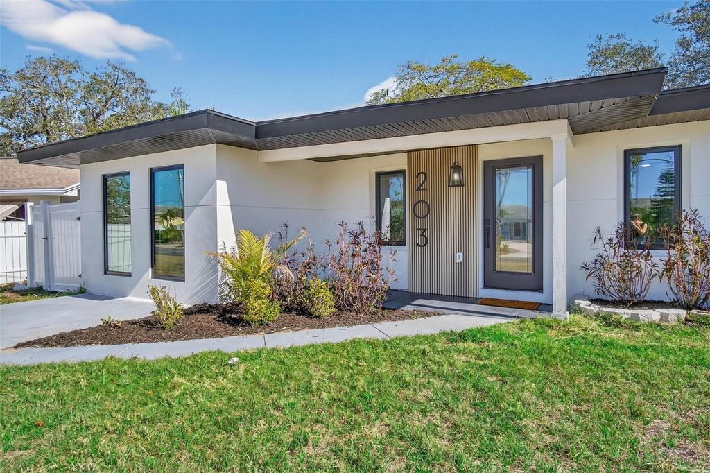 Photo of 203 Driftwood Drive W, Palm Harbor, FL 34683 (MLS # TB8478229)