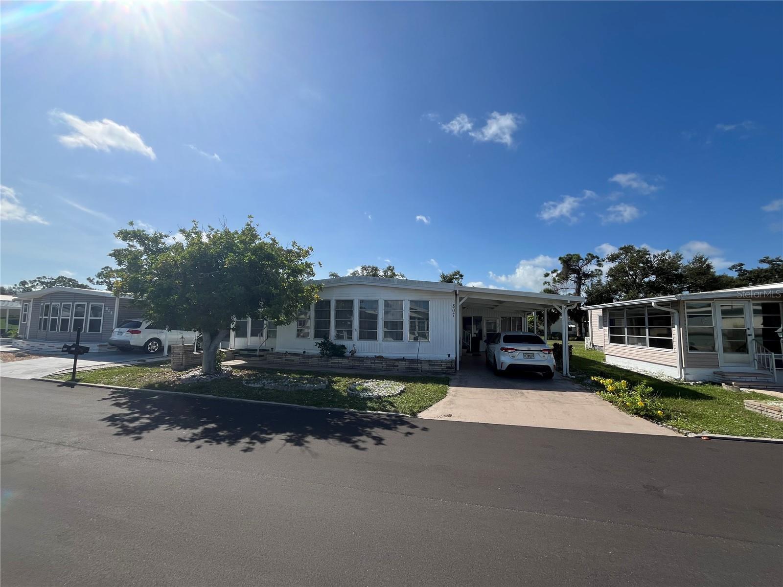 A huge home with loads of rear space, this home has Tons of storage with 2 added Florida rooms, 2 large sheds give a laundry and a work room too. This is a great Price with some TLC to up date it to the home you will love. AC is 2019. New carport less than 2 years old. Repiped for supply plumbing,. Membrane roof over approximately 2021.
Venice Isle is the premier resident owned over 55 Mobile home Park in Venice. There are close to 1000 homes with the most active residents. There is always something going on for you to do. We have many Park gatherings and first rate shows on site. The Park has every amenity you can imagine. Come take a walk through both of our 2 clubhouses and make yourself at home. The Park has 2 tennis courts, a fitness center, 2 heated pools, 2 hot tubs, saunas, putting greens, shuffleboard, Bocce ball, miniature golf, art rooms, pool room, TV lounges, card rooms, library, horseshoes, ceramic kilns, 2 huge ballrooms, Sunday services and much more!