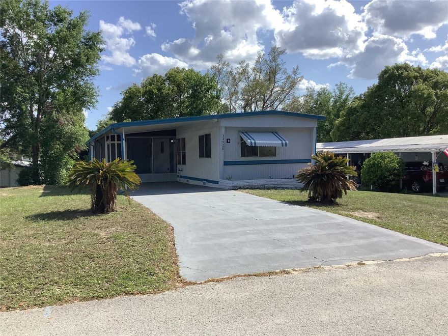 NO LOT RENT!!! County water and sewer.  No Mandatory HOA fees.   Must see to appreciate!  Superb condition and ready for new owner.  Don't let the age fool you, this owner has done all the work for you and it shows!  This move in ready mobile has new 3/4" tongue and groove exterior plywood subfloors throughout entire home along with new laminate flooring and commercial grade vinyl flooring in baths and laundry areas.  New bathroom fixtures and vanities, a new 50 gallon hot water heater along with a new central heat and air system that was installed April 2025.    All new pvc water lines installed throughout.  The kitchen has been updated with new custom cabinets, new above stove microwave and countertops.  You will also notice home has been freshly painted inside and out along with freshly painted drive and carport area.  Interior of the home has new trim and Wainscoting along with solid wood window casings and sills.  Enjoy your morning coffee or relax in the evenings on your 12x24 screened porch with new indoor outdoor carpeting.   There is also a great storage/workshop area.   If you are looking for the perfect retirement or winter retreat, look no further!  Located in a quiet community and awaiting your arrival and your personal touch.
